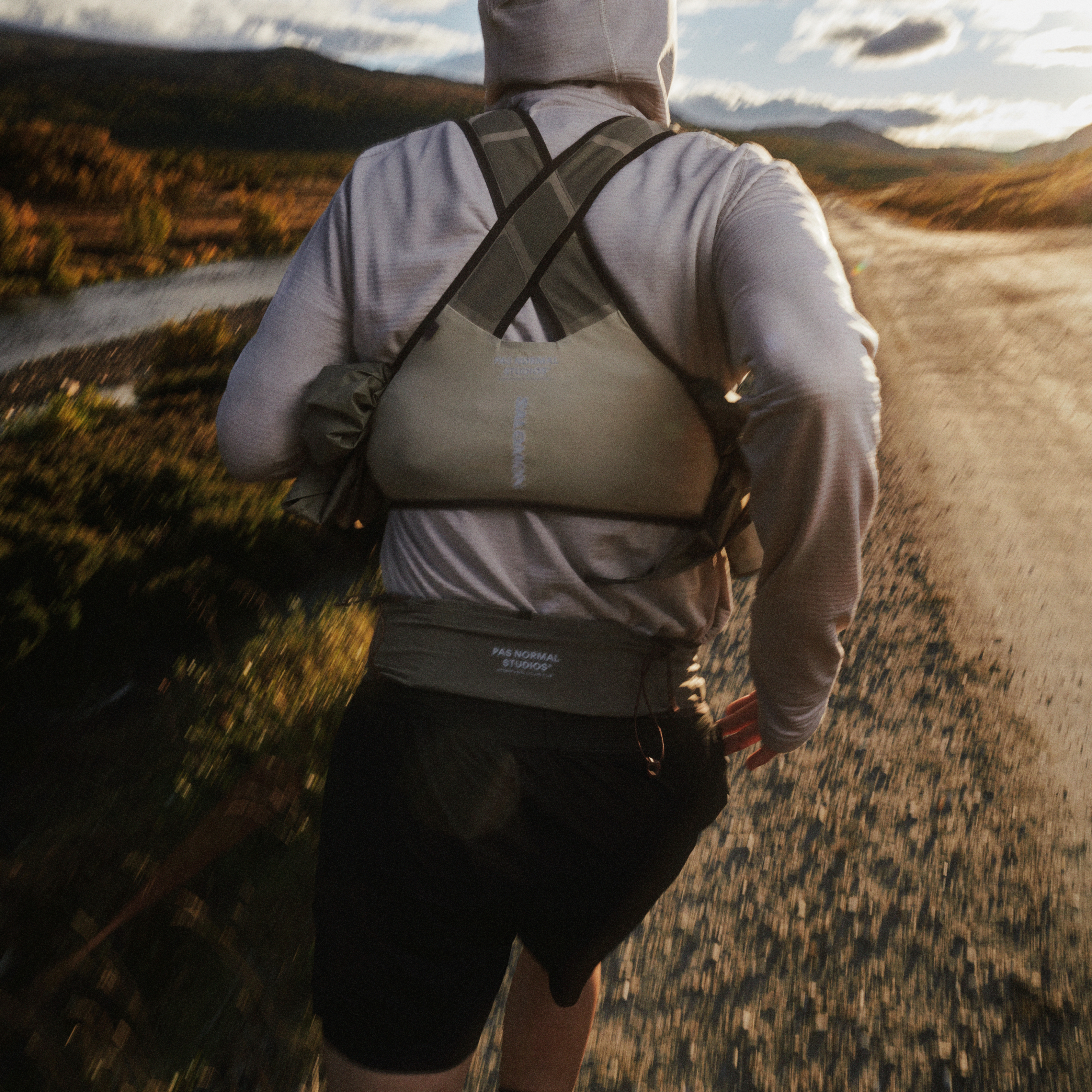 Off-Race khaki Aero Blaze 4 GRVL GTX vest on model, rear view with cross-back harness straps