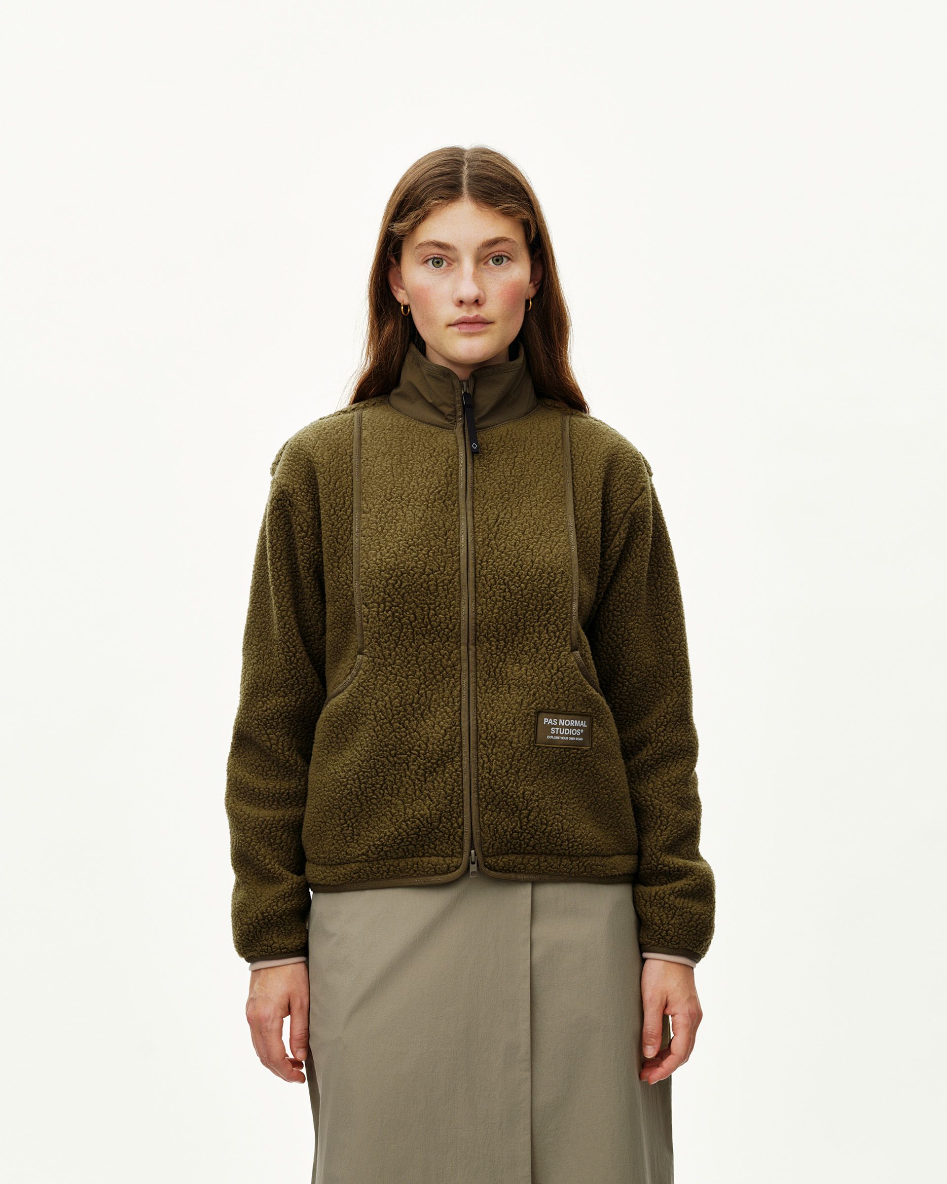 Deep Olive Off-Race Pile Fleece jacket on model, front view with full zip and branded patch pocket