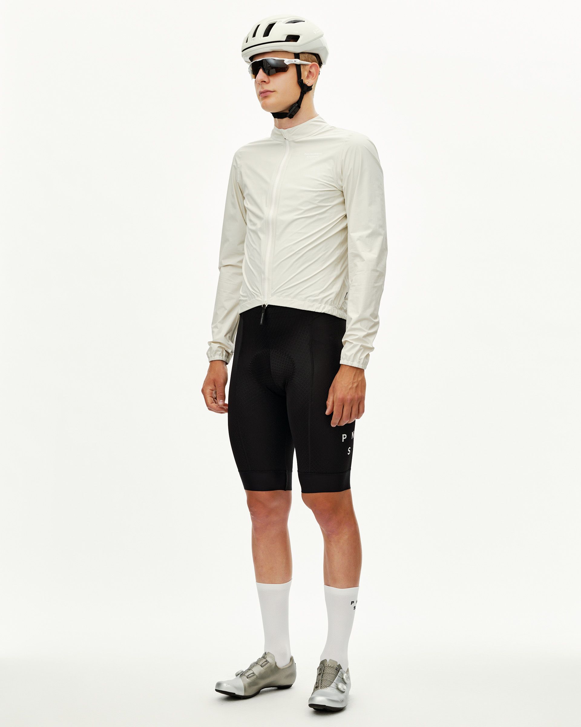 Off White Mechanism cycling rain jacket on model, three-quarter front view with full zip