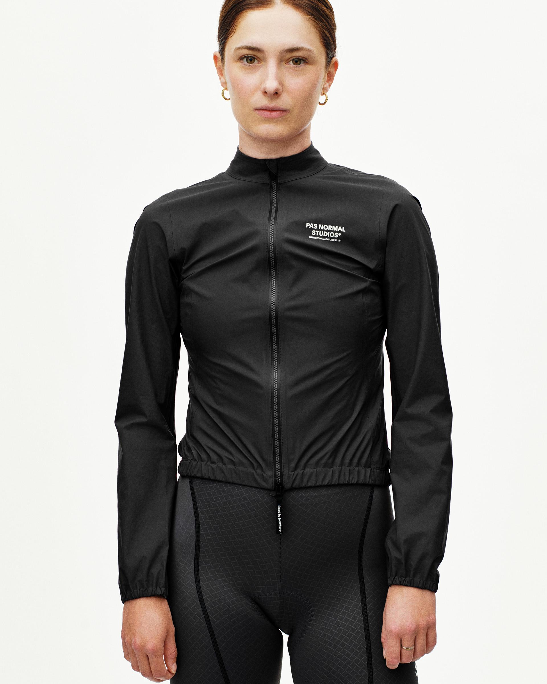 Black Mechanism Rain cycling jacket on model, front view with full zip and white chest logo