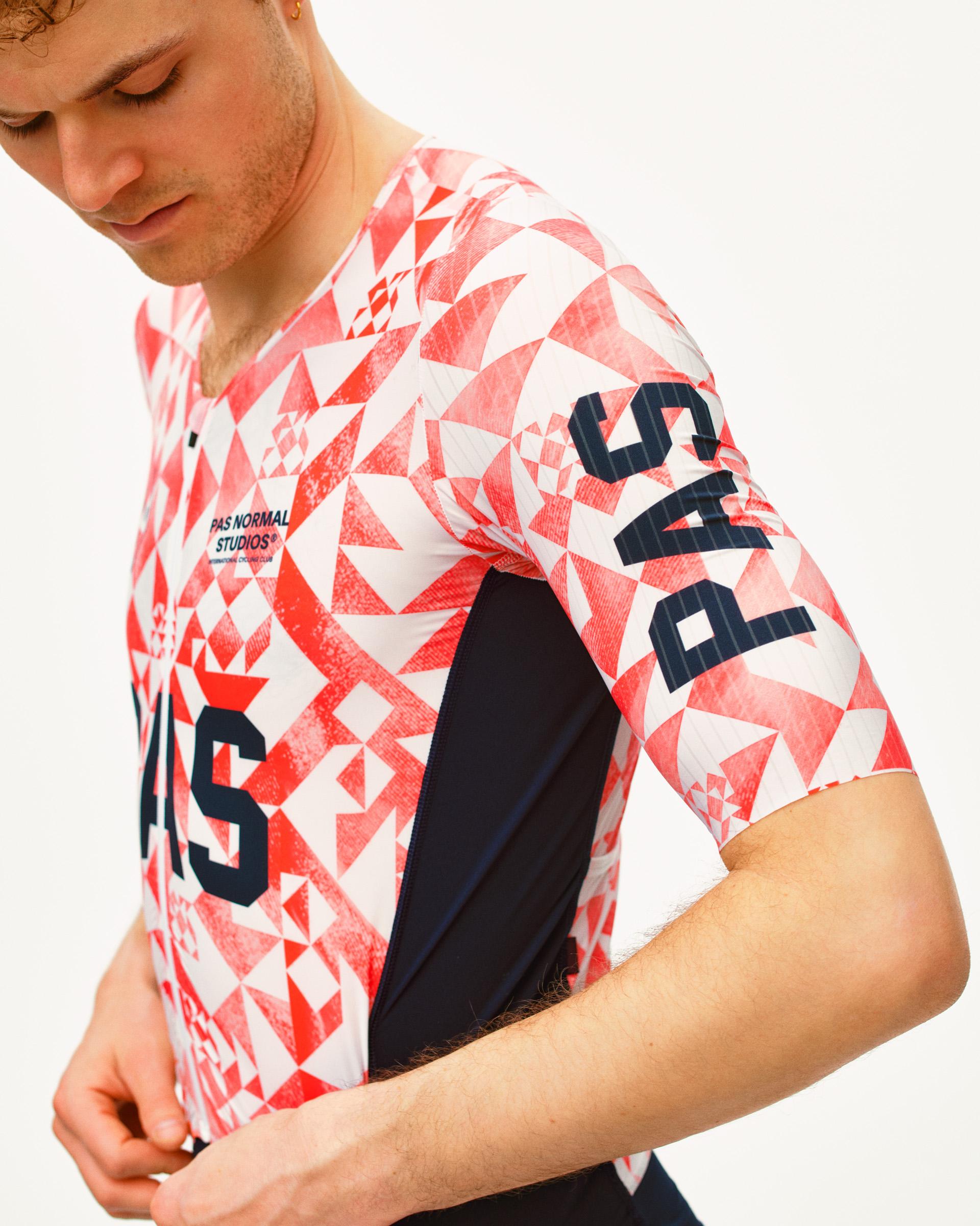Red PAS Mechanism Pro Speedsuit on model with geometric origami print and black side panels