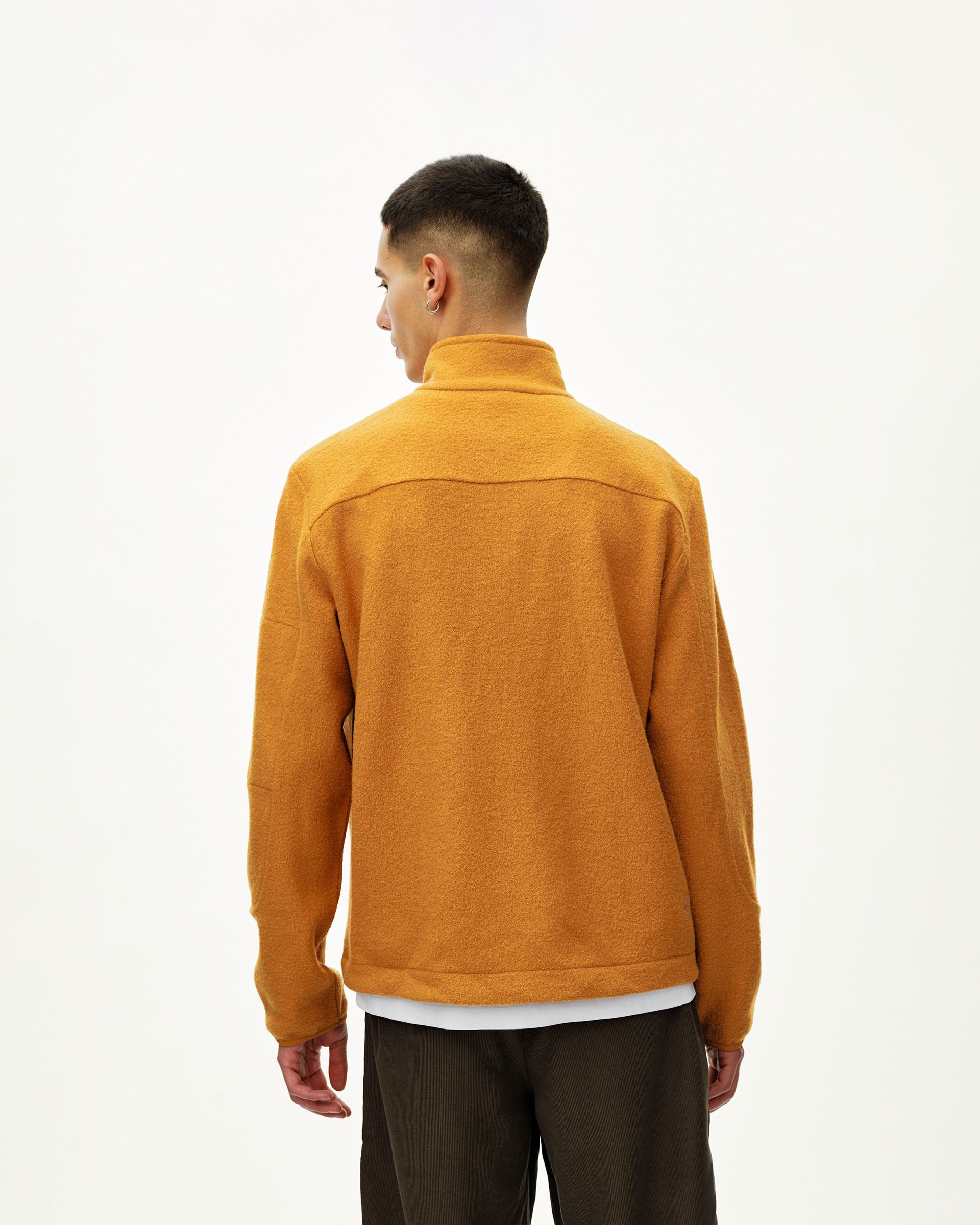 Ochre Off-Race Boiled Wool Half-Zip jacket on model, rear view with funnel collar
