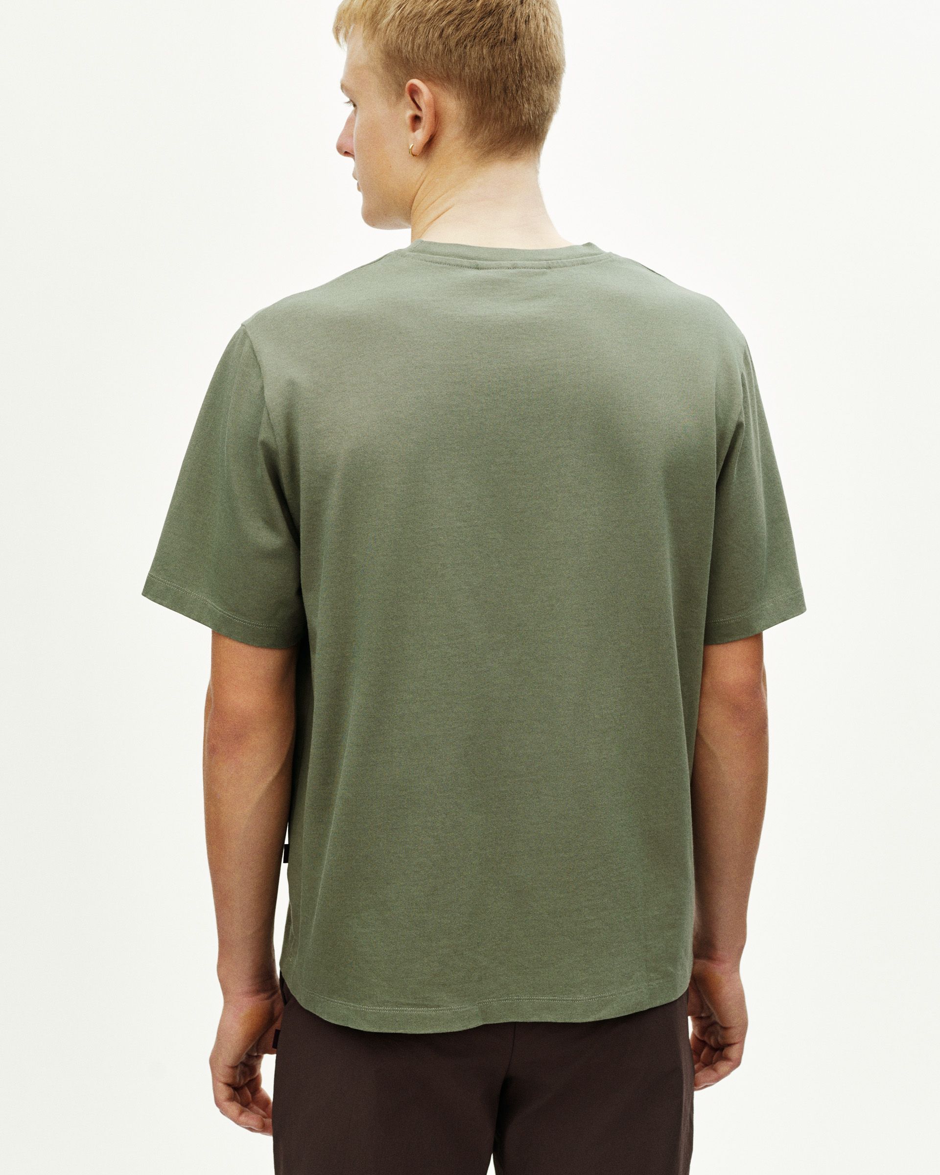 Green Off-Race t-shirt, rear view on model with relaxed fit