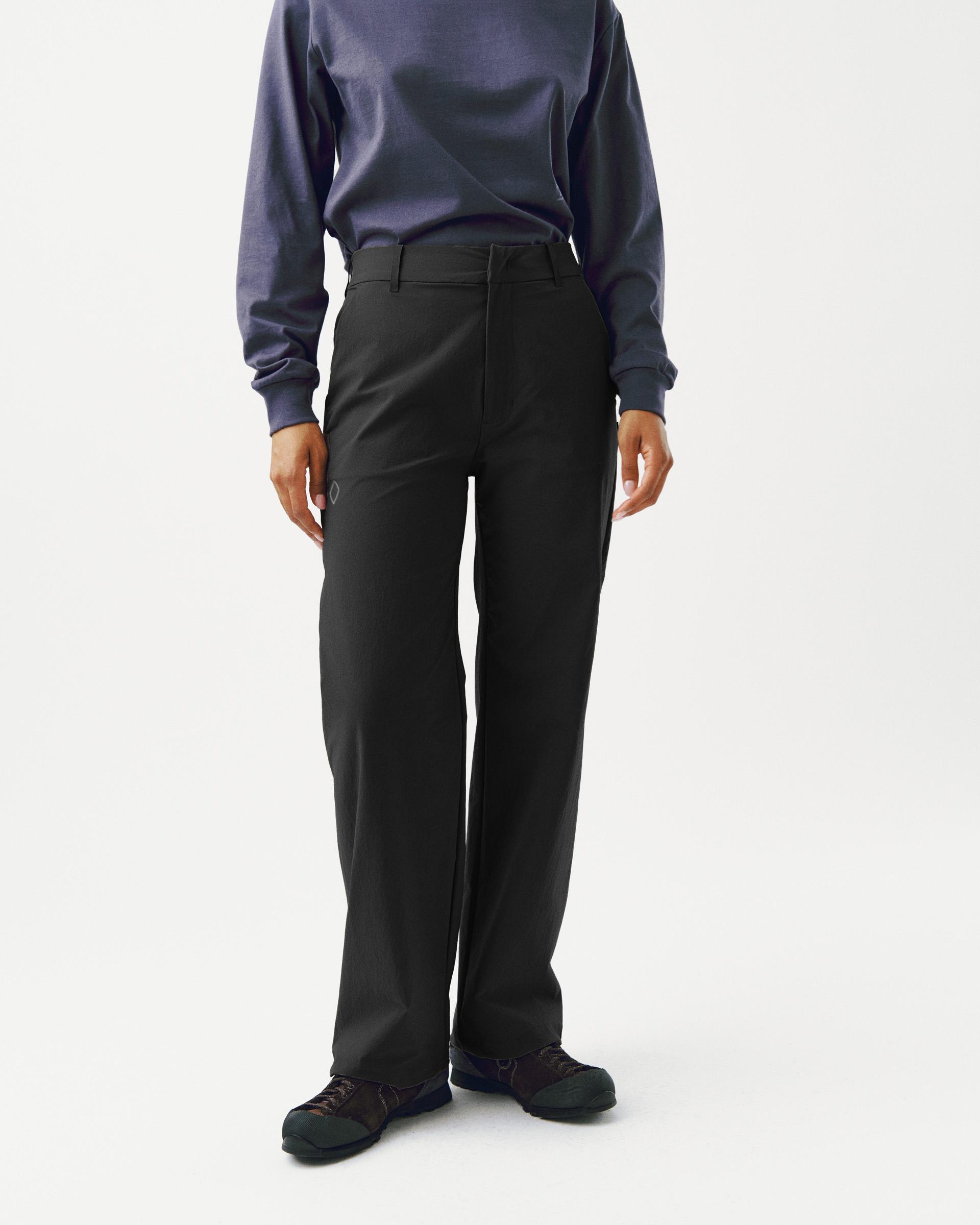 Black Off-Race Tech pants on model, front view with straight leg and belt loops