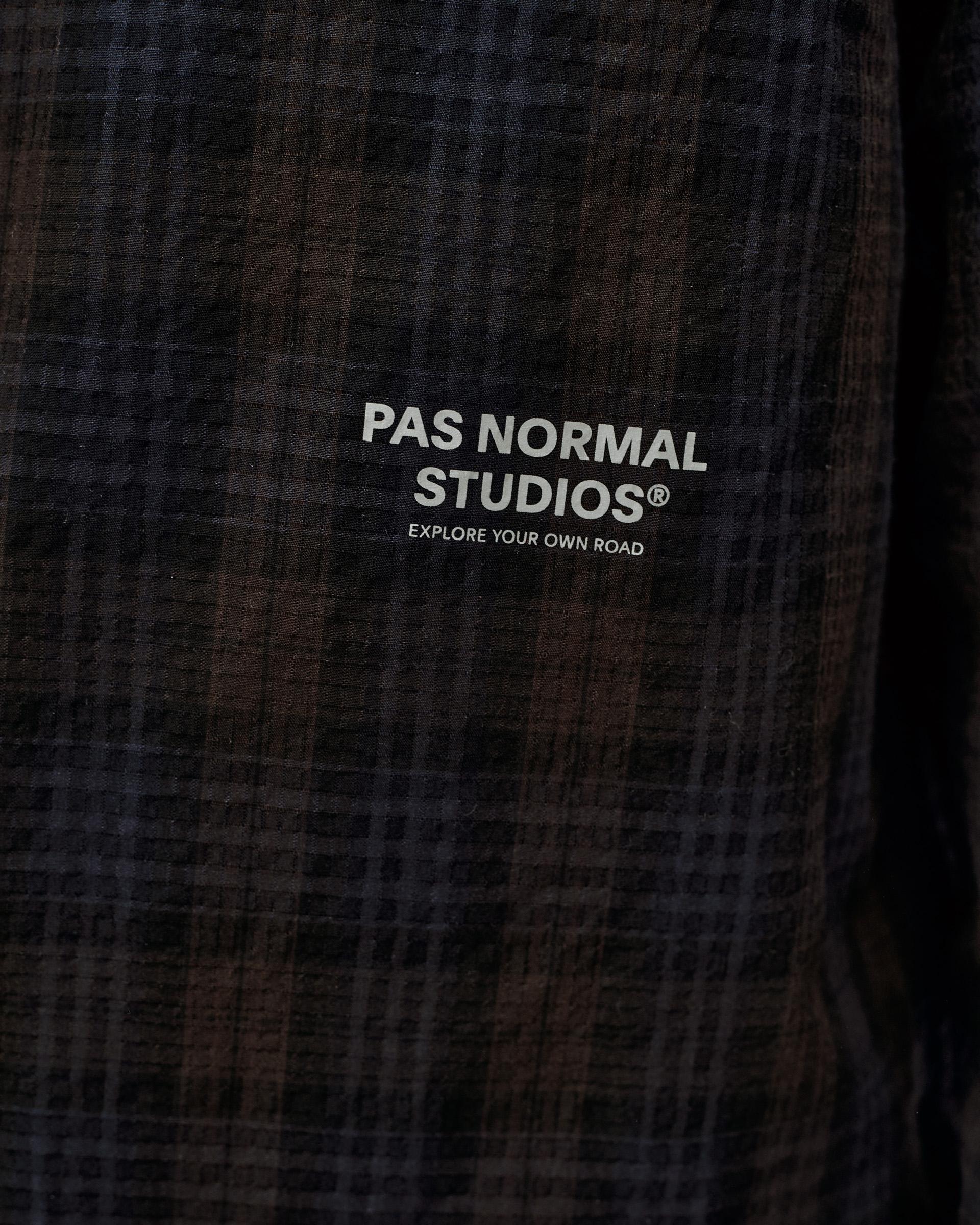 Dark Navy Off-Race Seersucker shirt, detail view of chest logo on dark plaid textured fabric