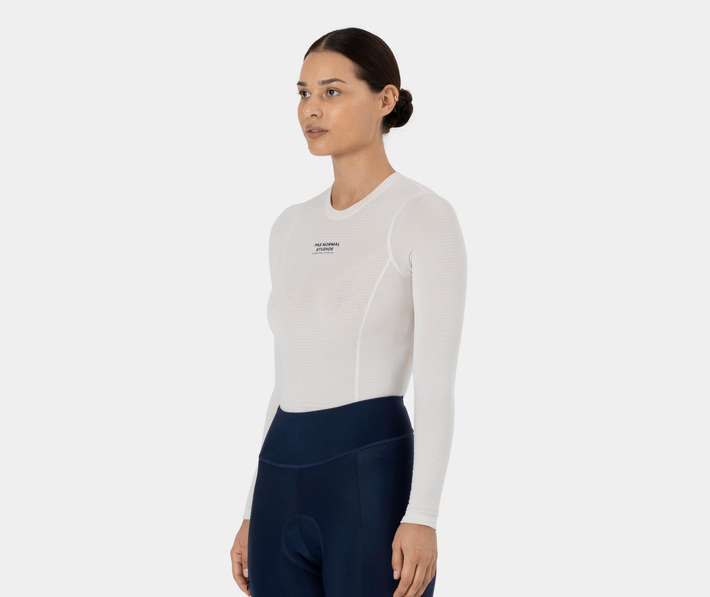 Off White Thermal Long Sleeve base layer on model, three-quarter view with black chest logo