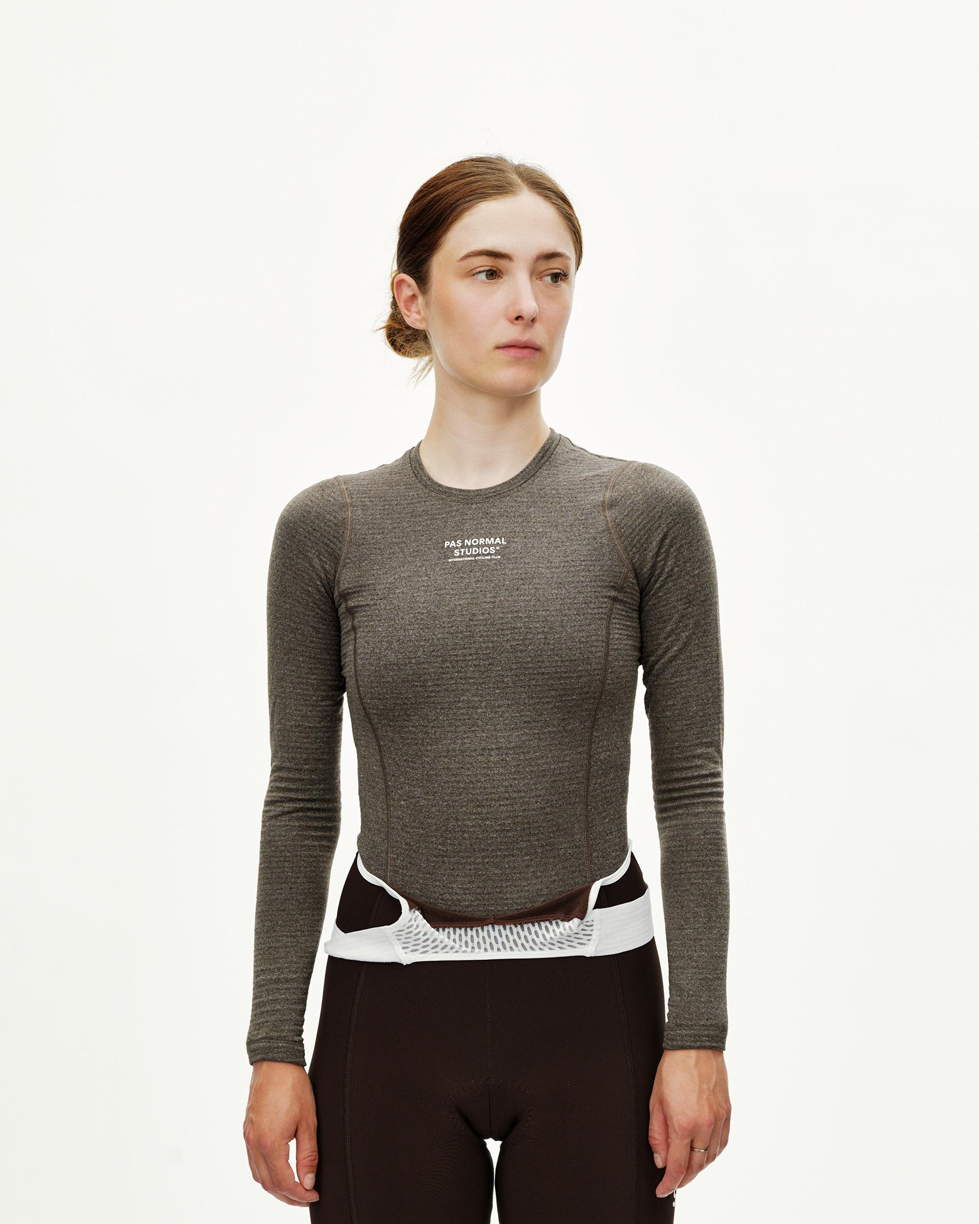 Dark Coffee brown Essential women's long sleeve cycling baselayer on model, front view with white chest logo print