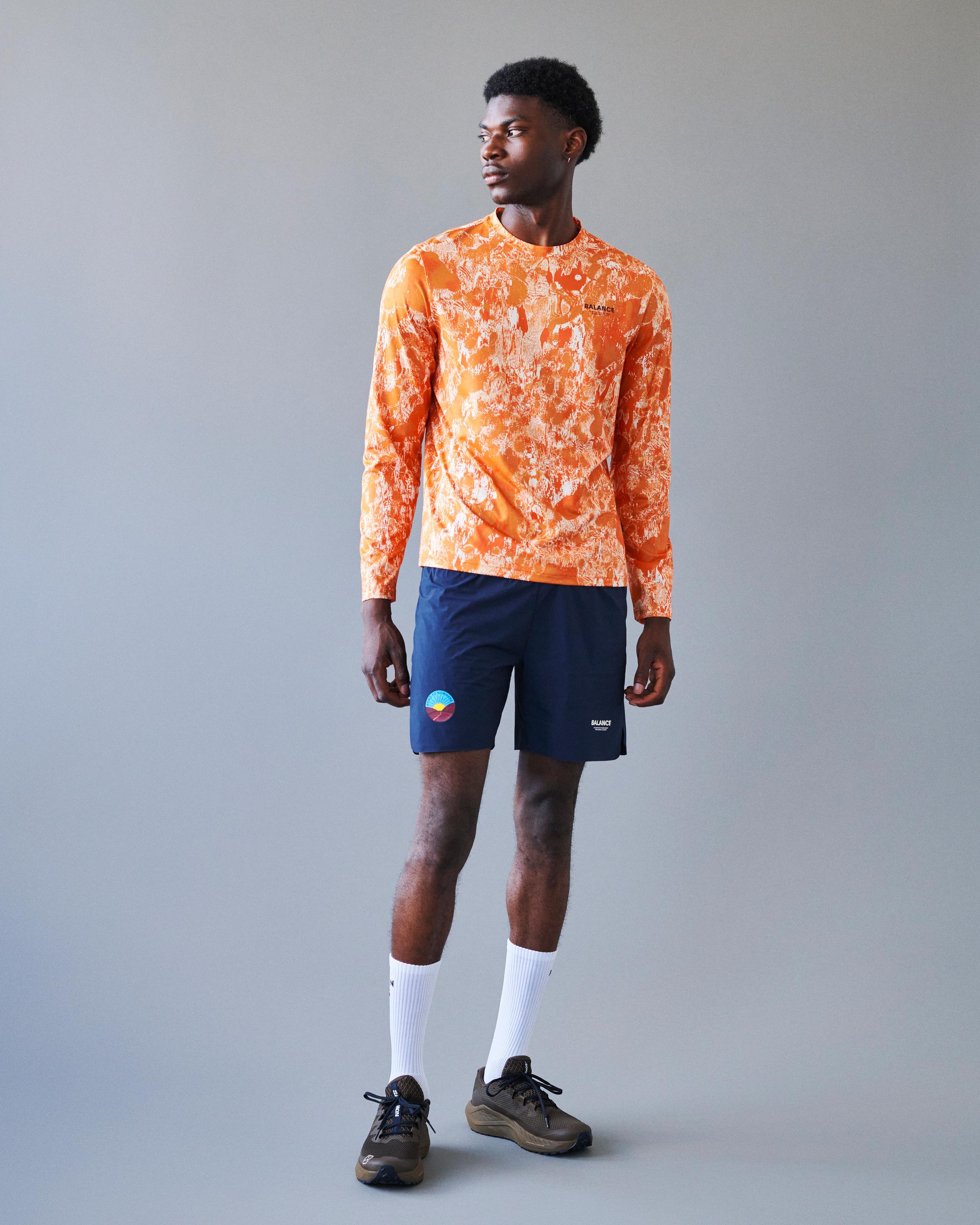 Orange Balance long sleeve t-shirt on model with abstract white print pattern