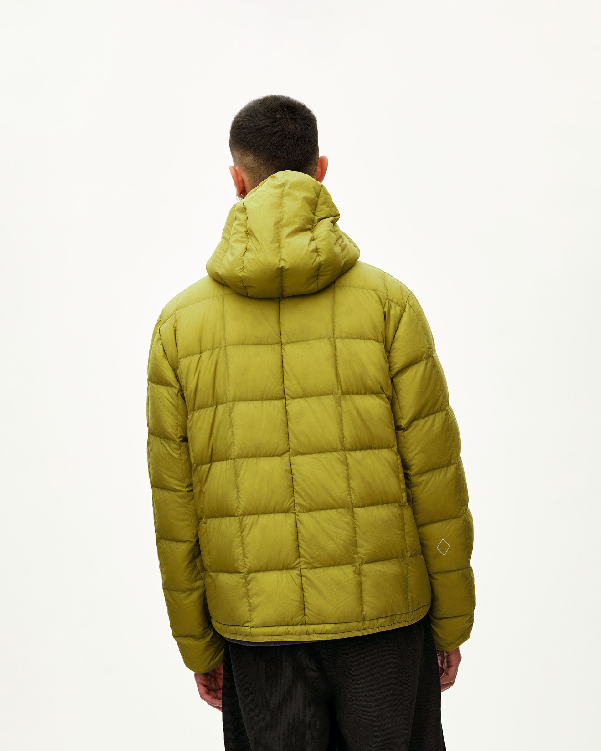 Dark Lime green Off-Race Down Liner jacket on model, rear view with box quilting and hood
