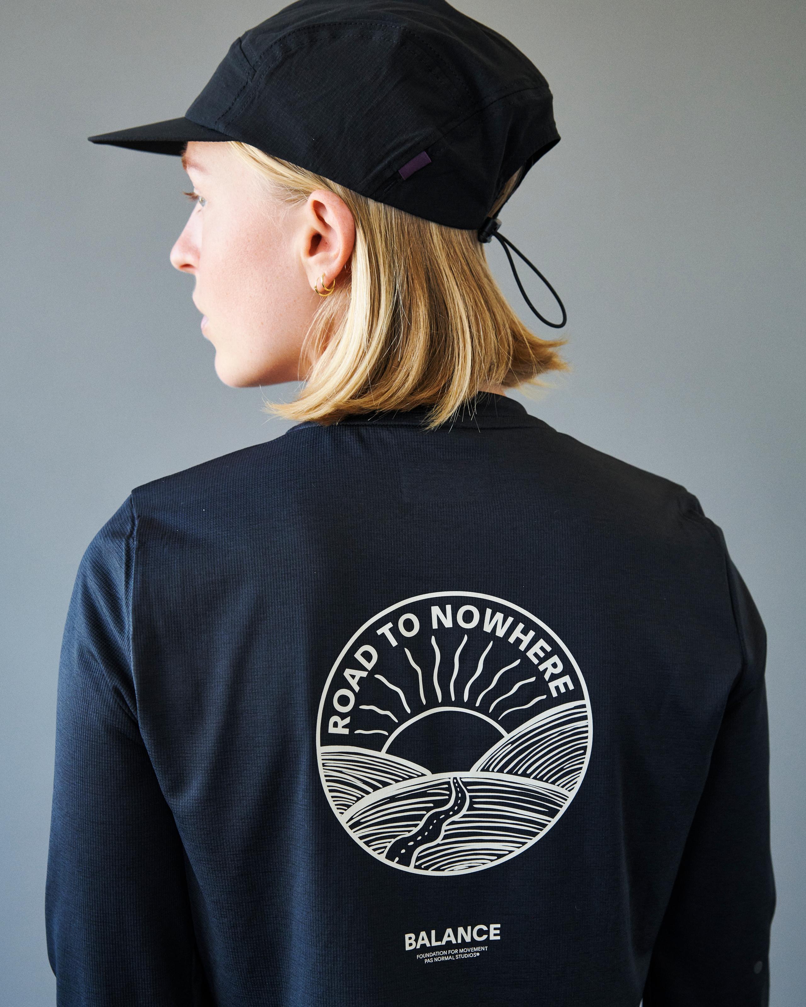 Black Balance long sleeve t-shirt on model, rear view with white Road to Nowhere sun print