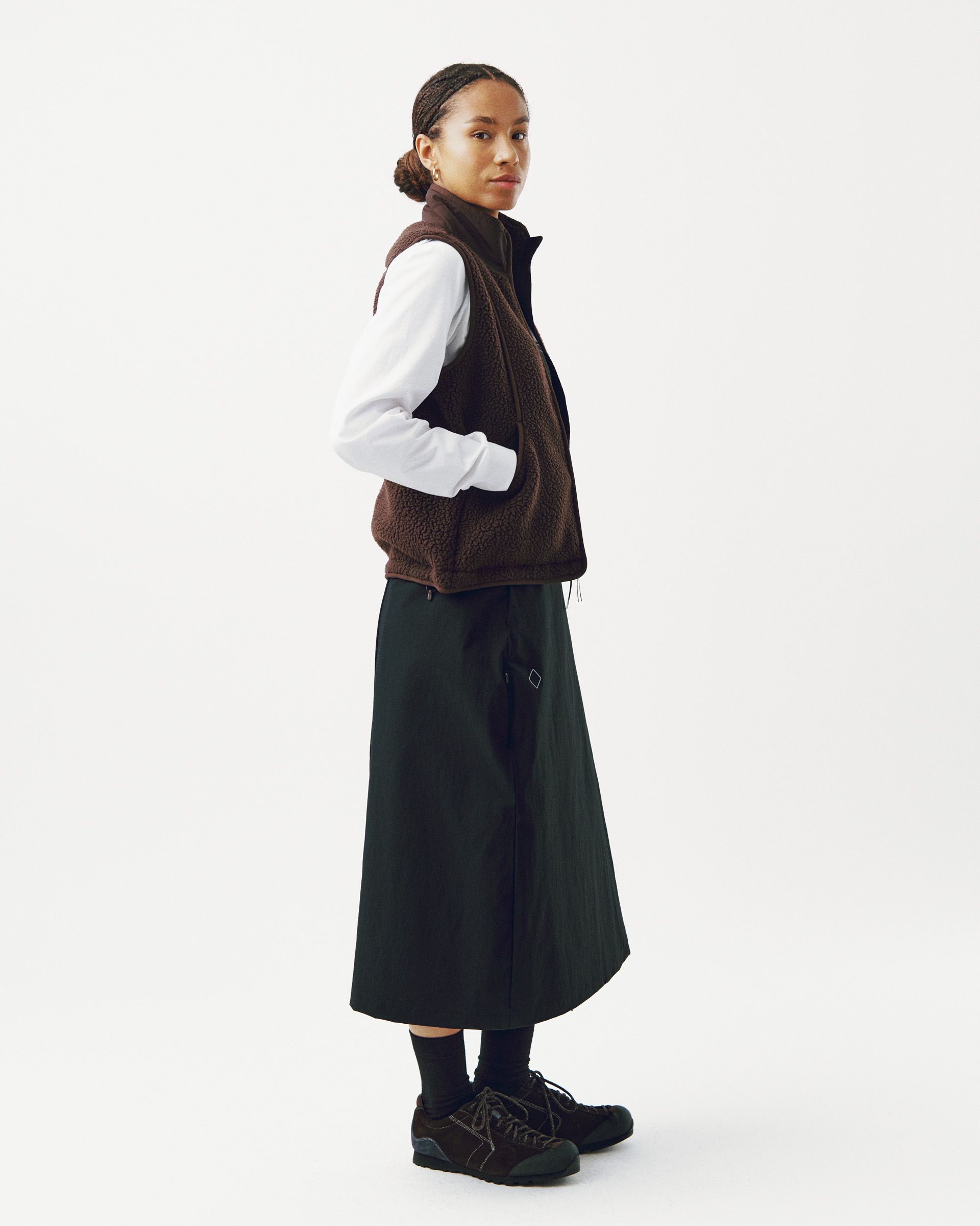 Light Brown Off-Race Pile Fleece vest on model, side view with textured fleece fabric