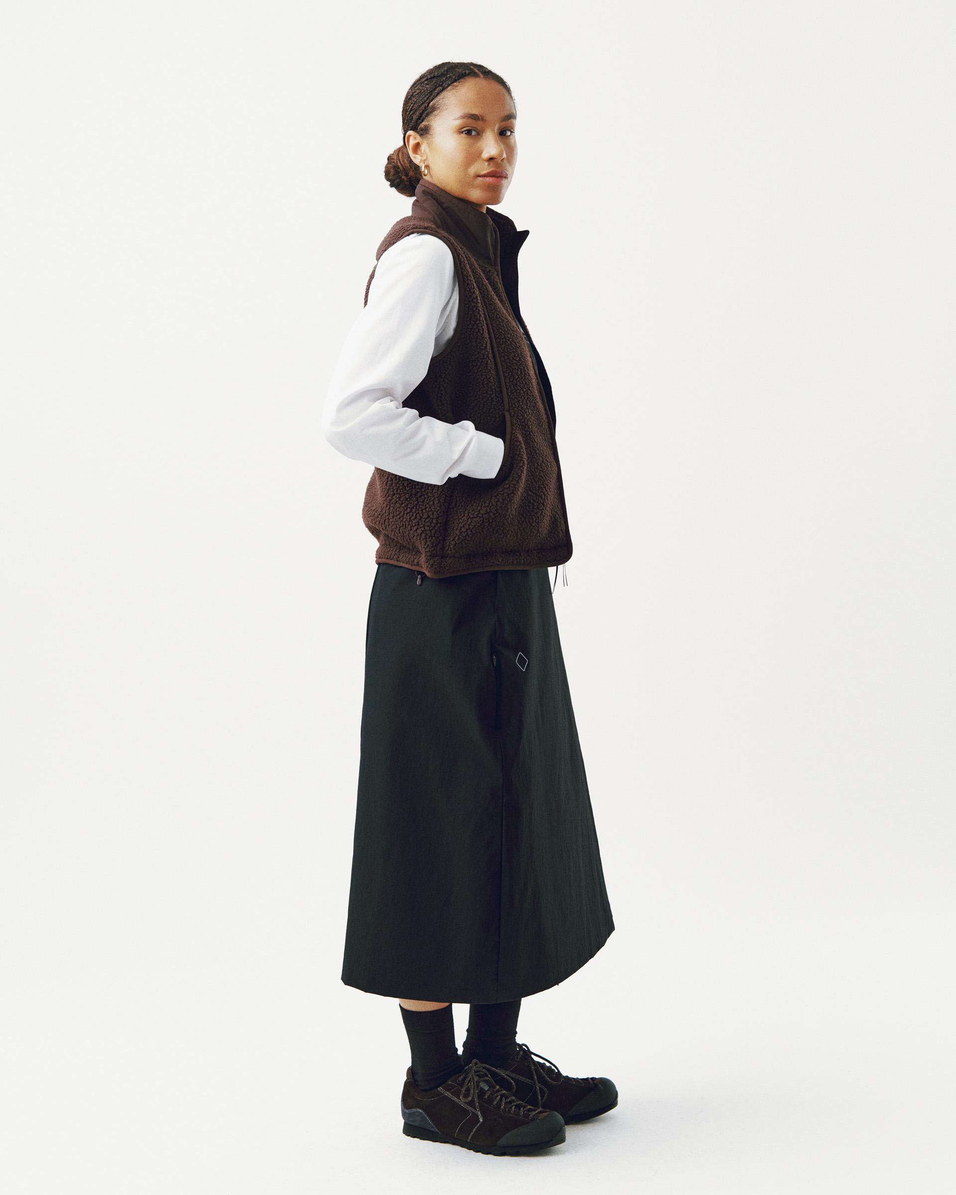 Light Brown Off-Race Pile Fleece vest on model, side view with textured fleece fabric