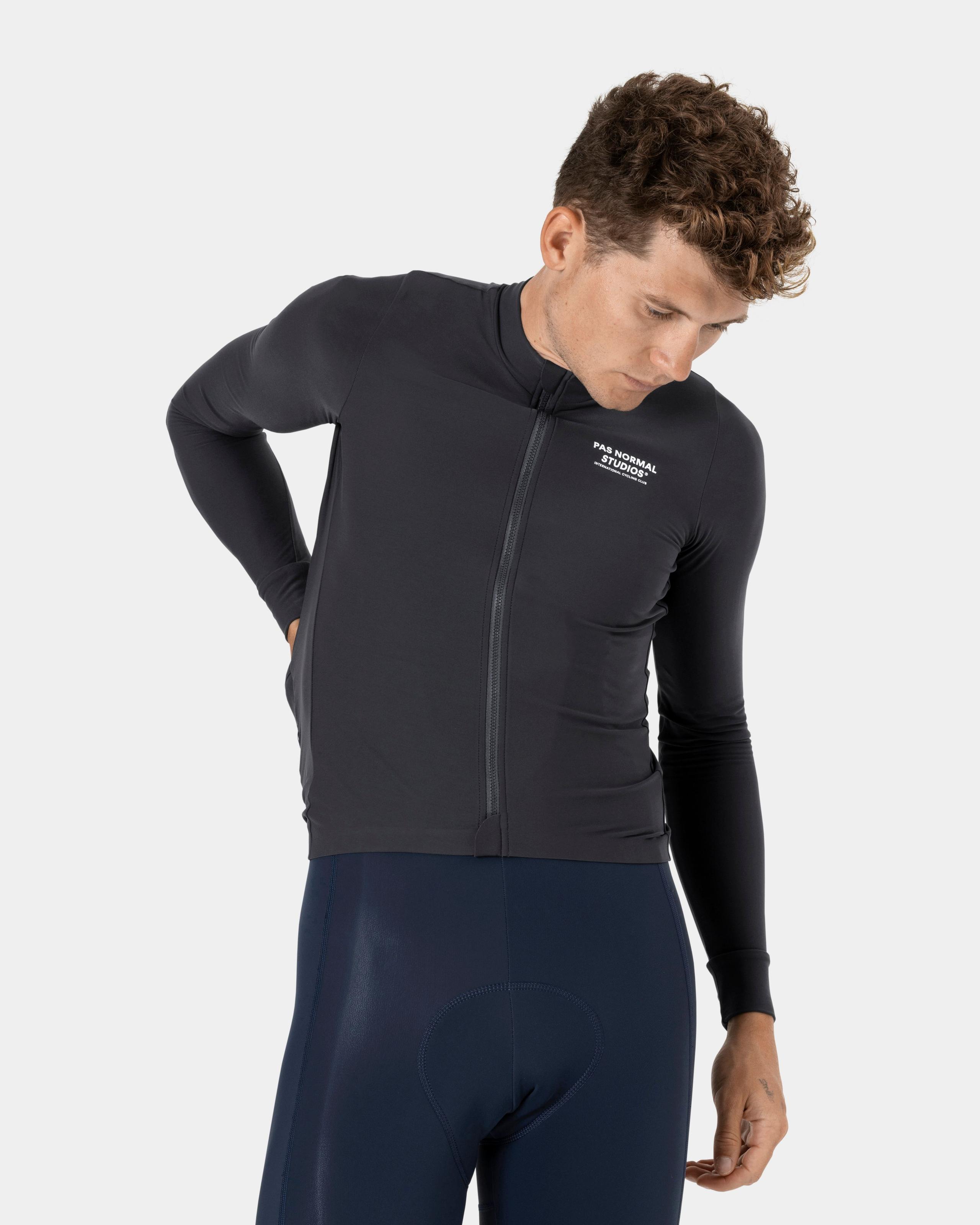 Black Mechanism long sleeve cycling jersey on model with full zip and white chest logo