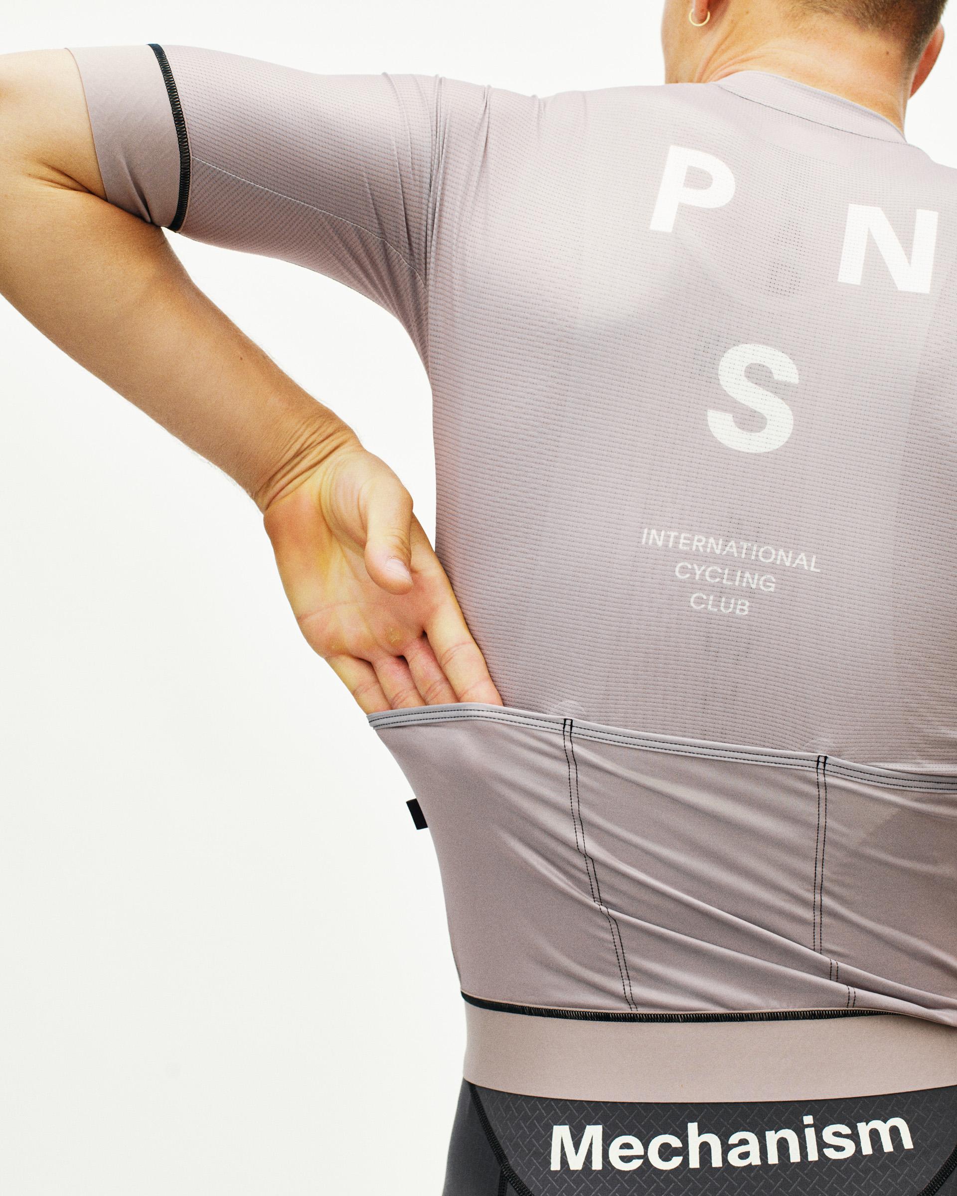 Grey Mechanism cycling jersey on model, rear view with white back print