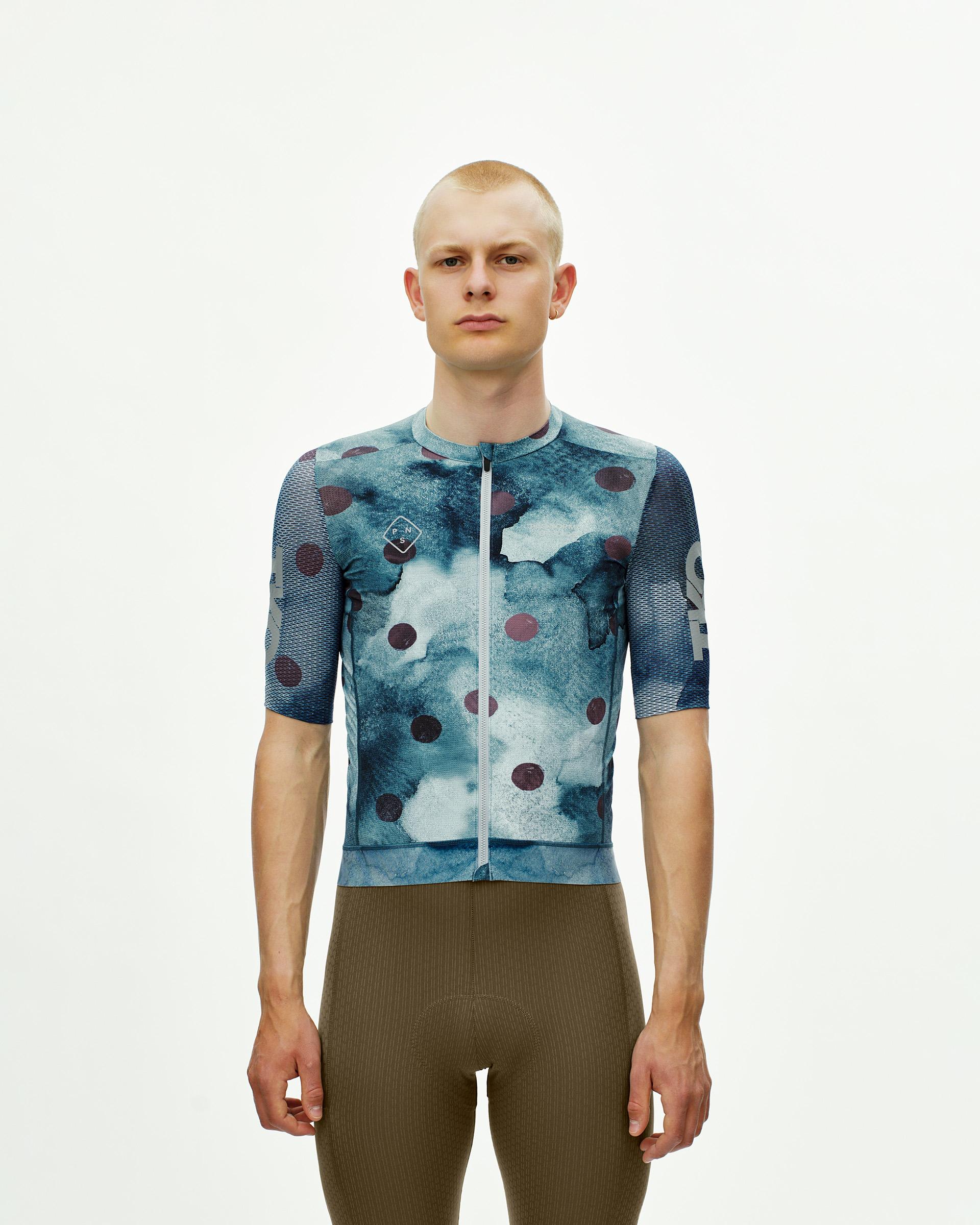 Dark Purple T.K.O. Essential Light cycling jersey on model with polka dot print and mesh sleeves