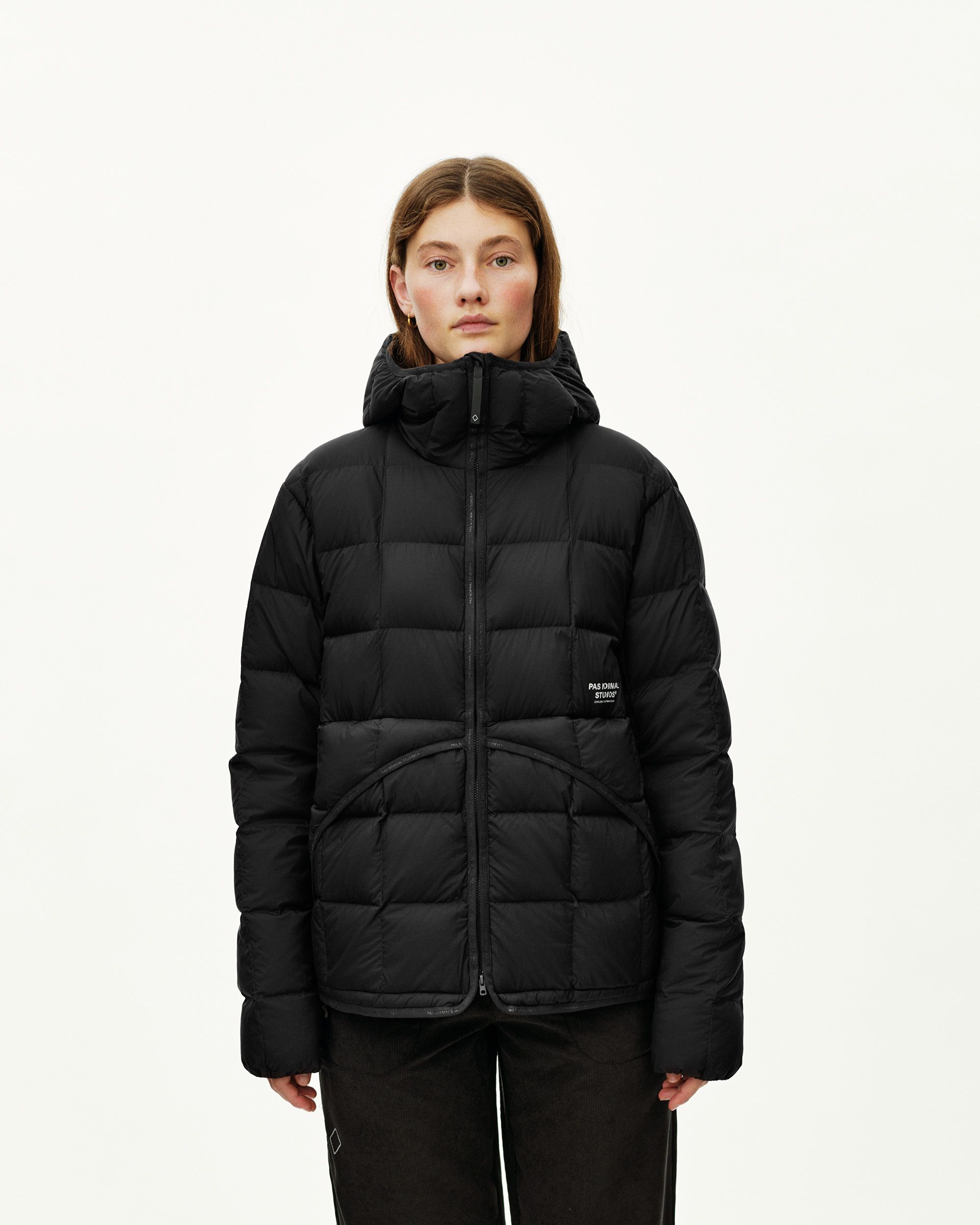 Black Off-Race Down Liner jacket on model, front view with quilted panels and attached hood