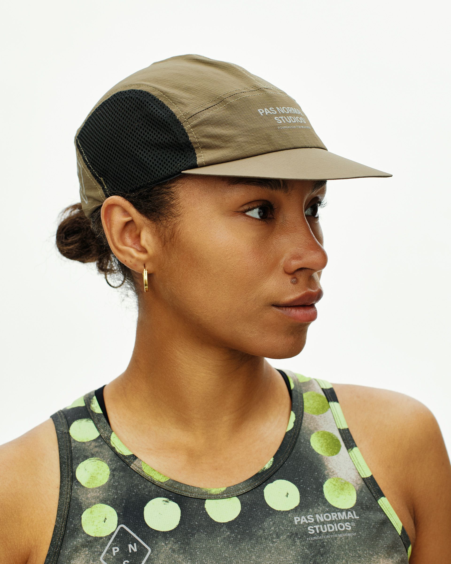 Dark Stone T.K.O. Balance cap on model, side view with black mesh side panels