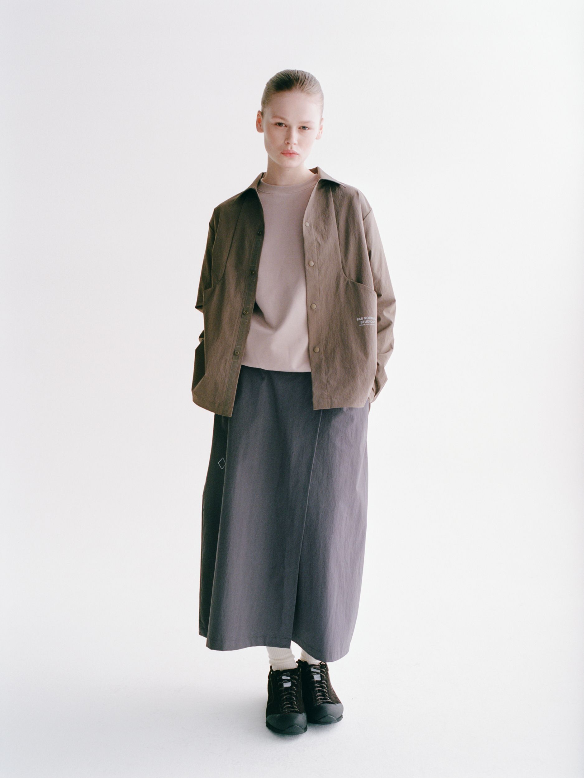Brown Off-Race Tech Overshirt on model, front view with button closure