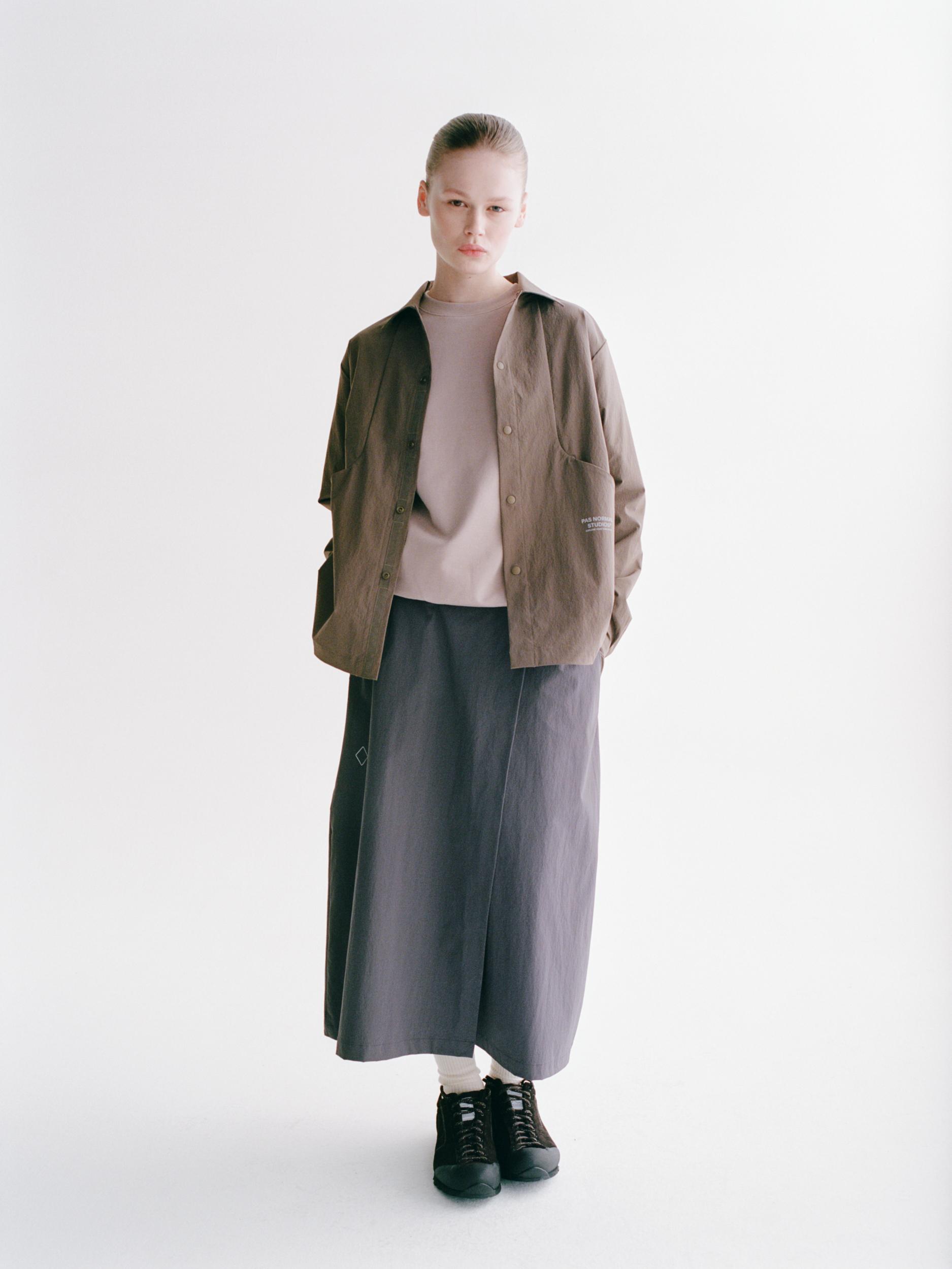 Brown Off-Race Tech Overshirt on model, front view with button closure