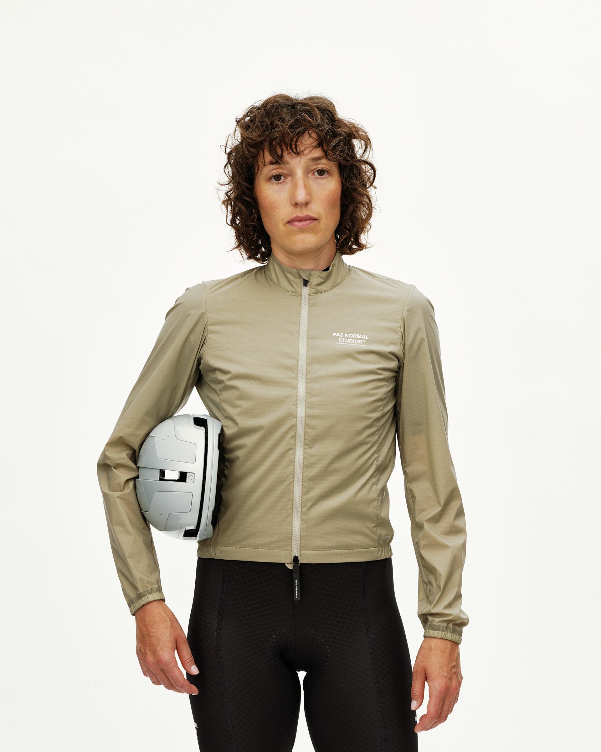 Grey Sage Essential Insulated cycling jacket on model, front view with full zip and white chest logo