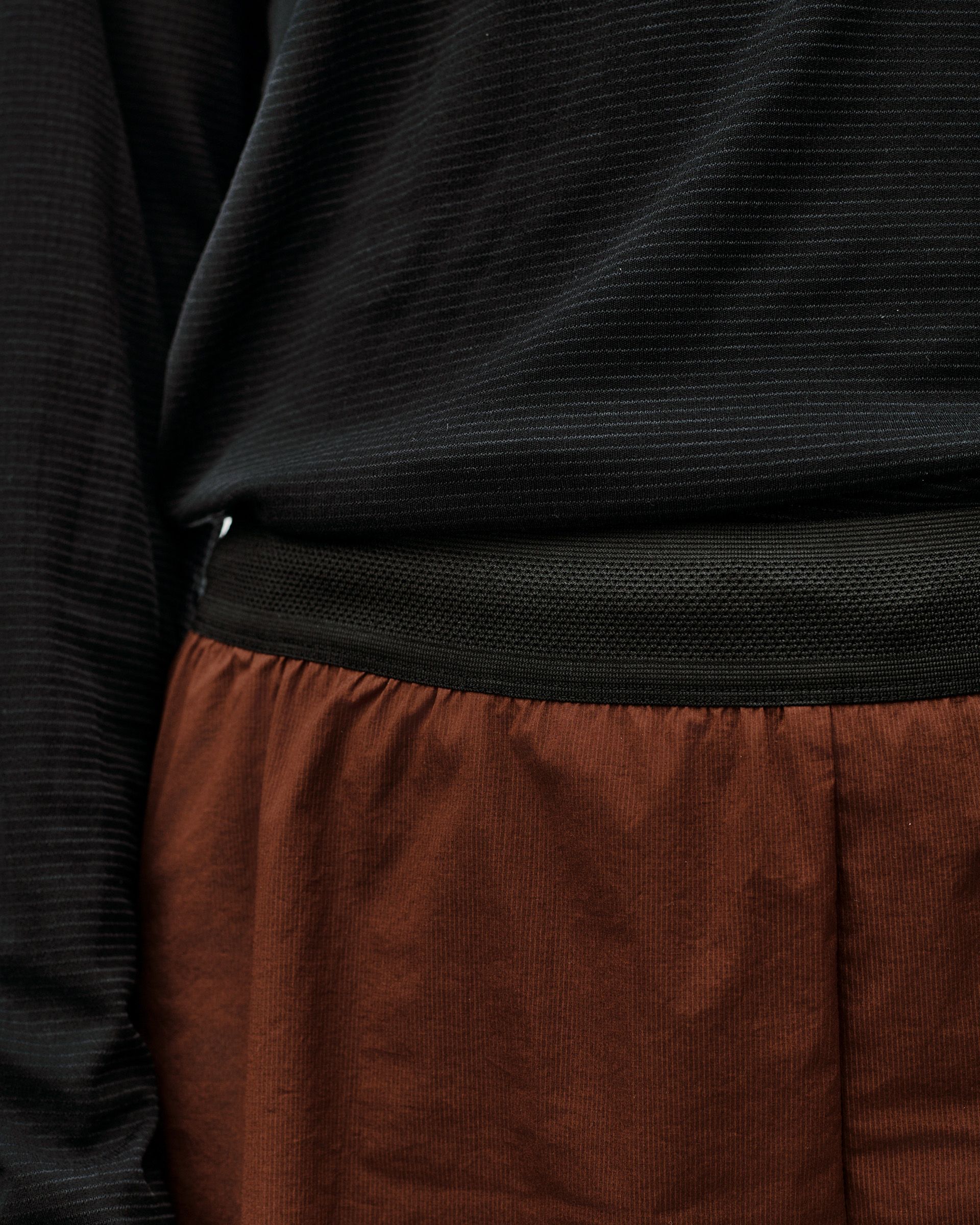 Maroon Brown Balance 2-in-1 shorts, detail view showing elastic waistband and inner liner hem