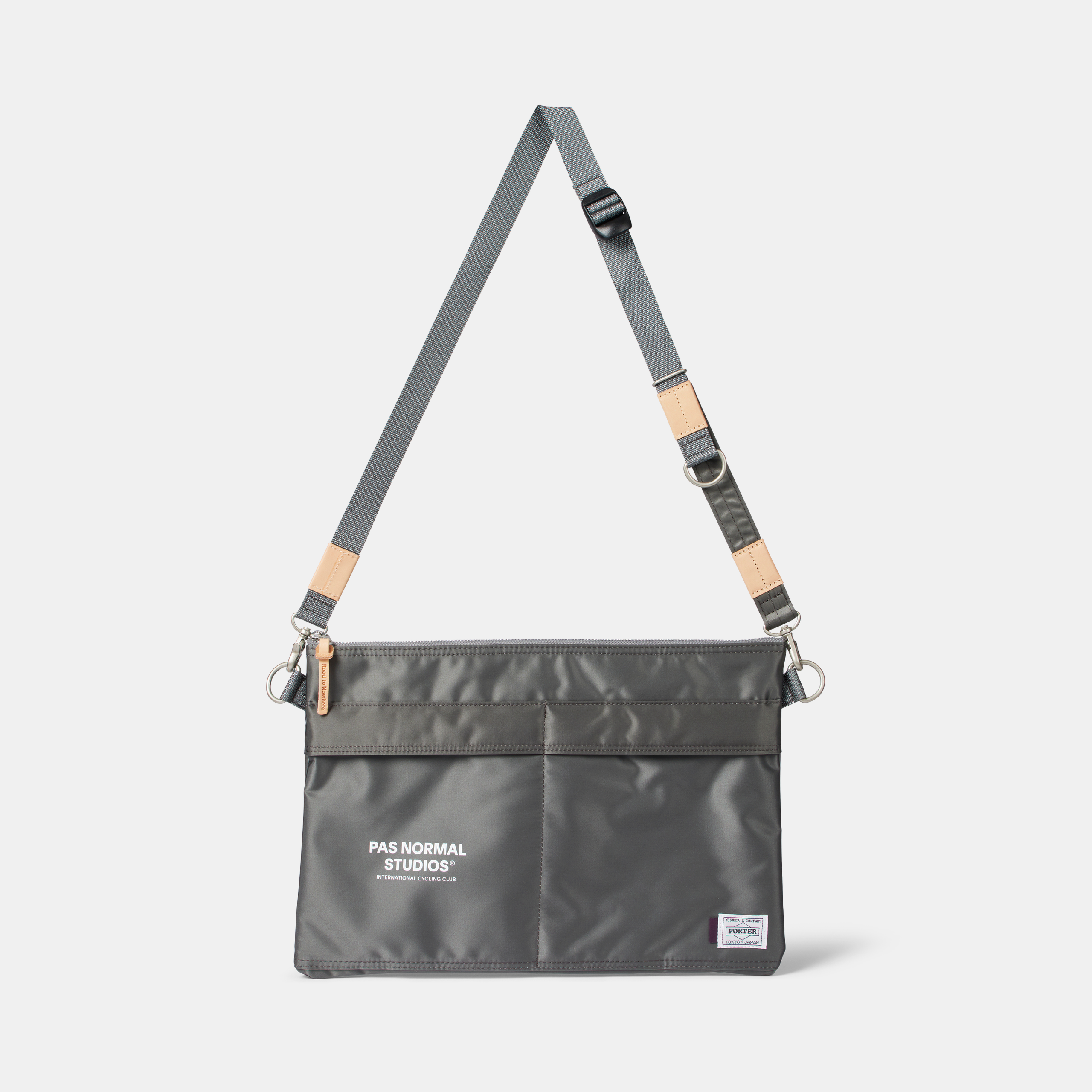 Grey Porter-Yoshida musette, front view with adjustable shoulder strap and tan leather trim