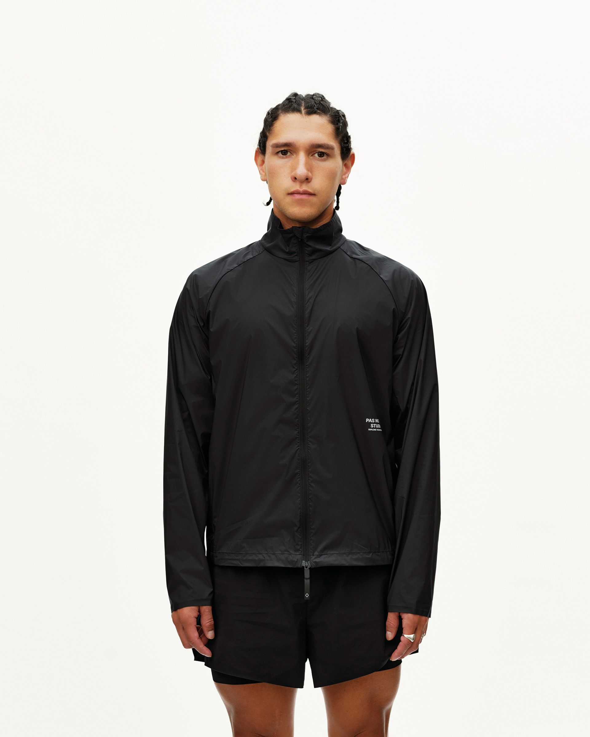 Black Balance Windproof jacket on model, front view with full zip and small chest logo print