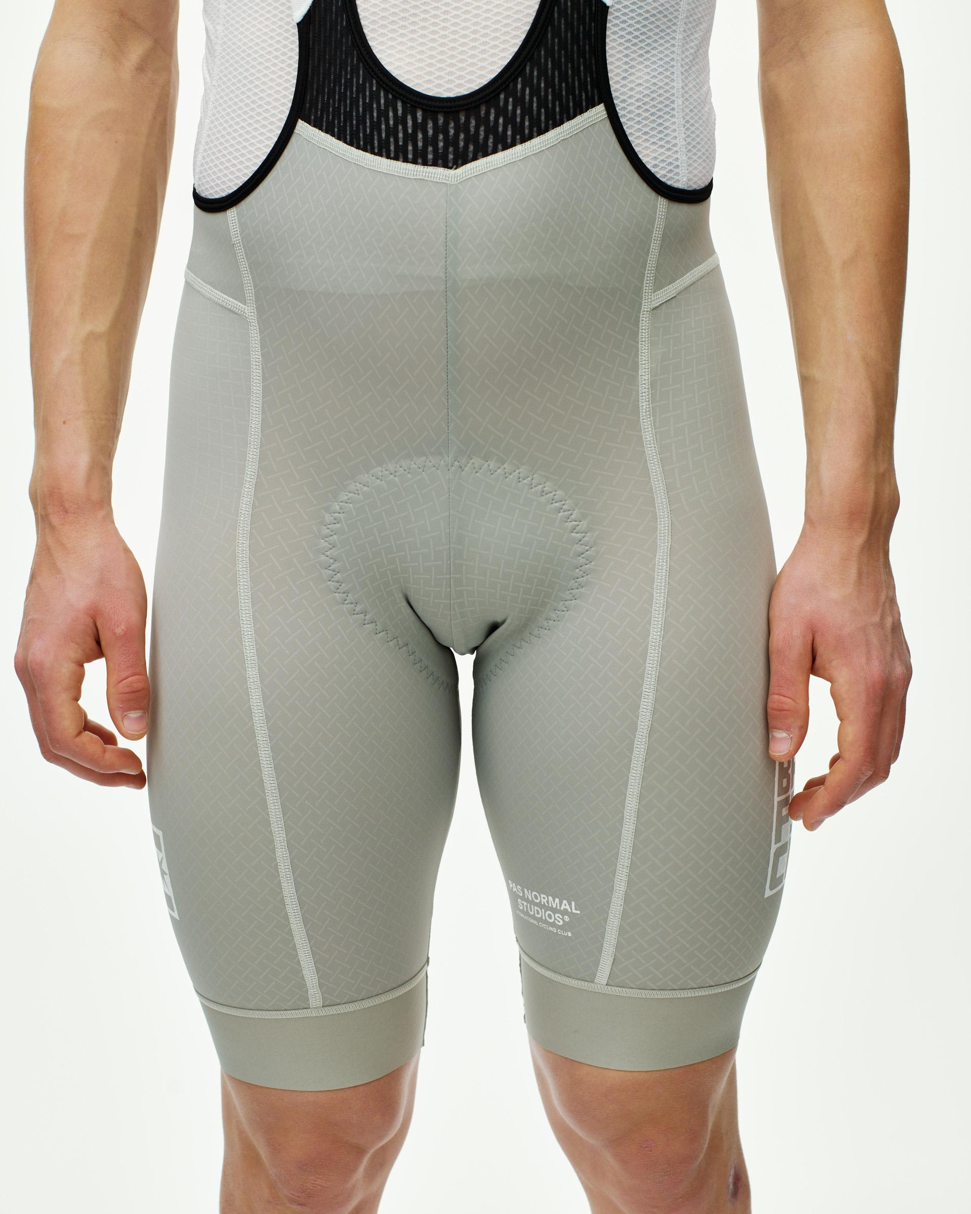 Light Grey Breakfast Club Mechanism cycling bibs on model, front view with contrast stitching