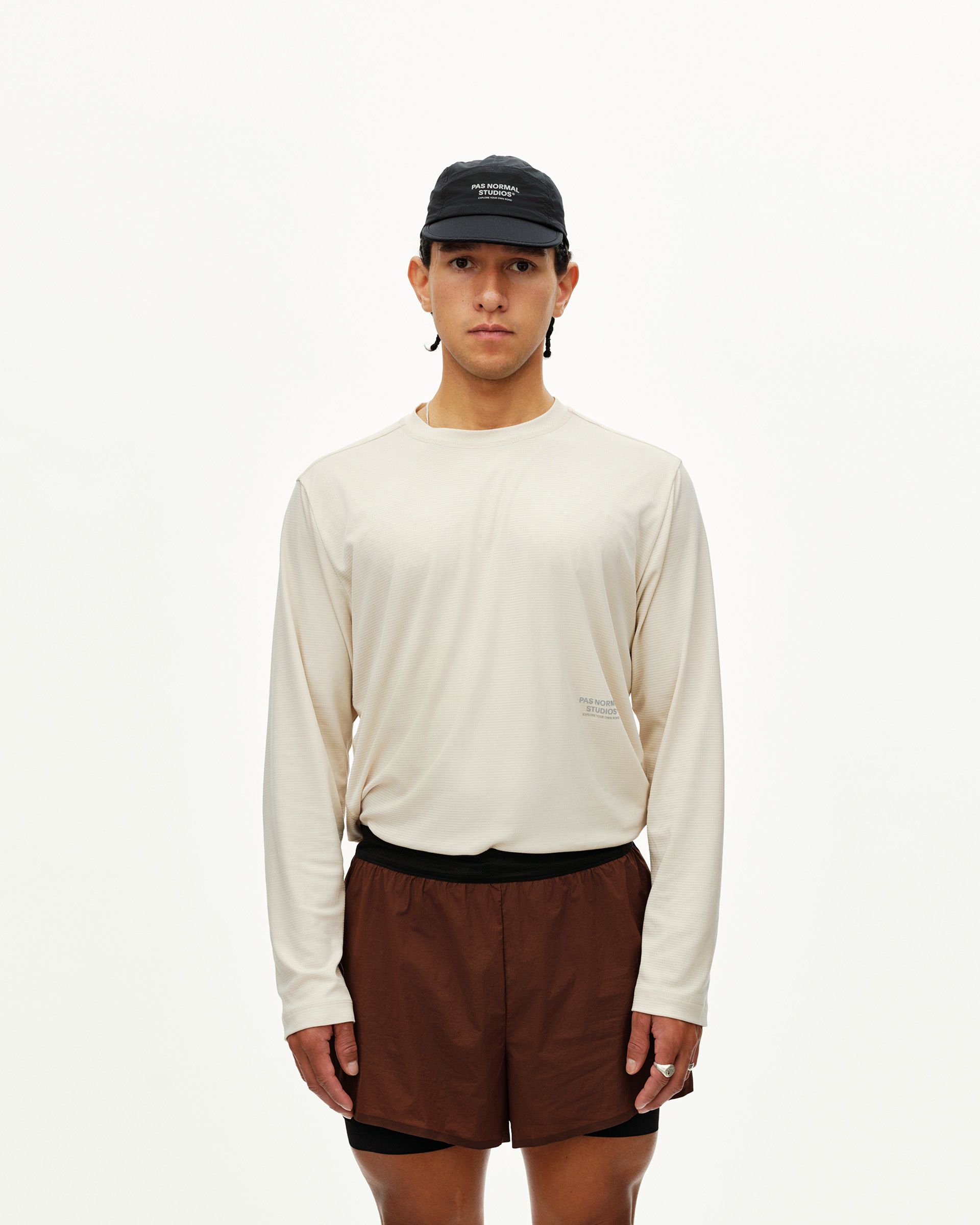 Maroon Brown Balance 2-in-1 shorts on model, front view with black inner liner and waistband