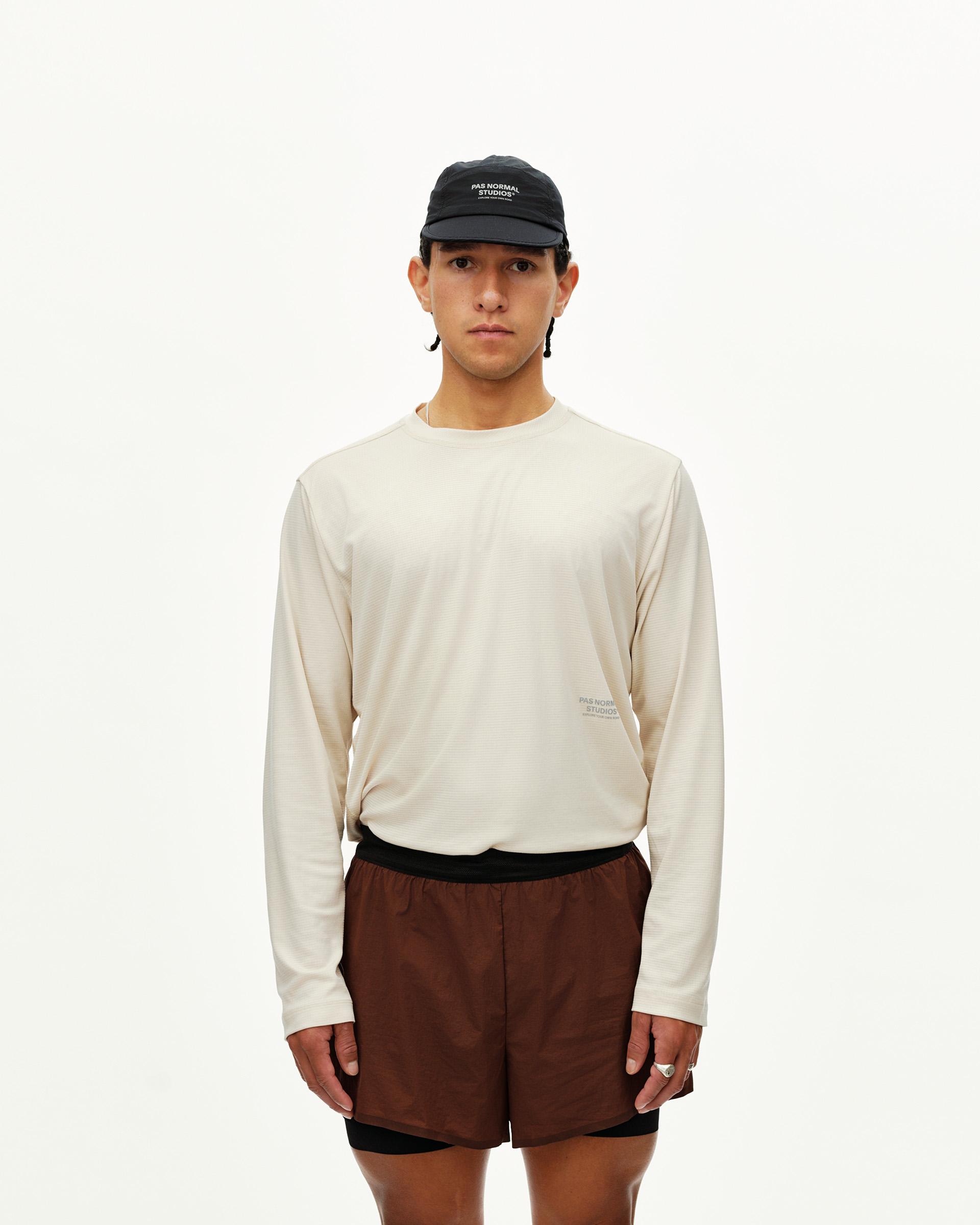 Maroon Brown Balance 2-in-1 shorts on model, front view with black inner liner and waistband