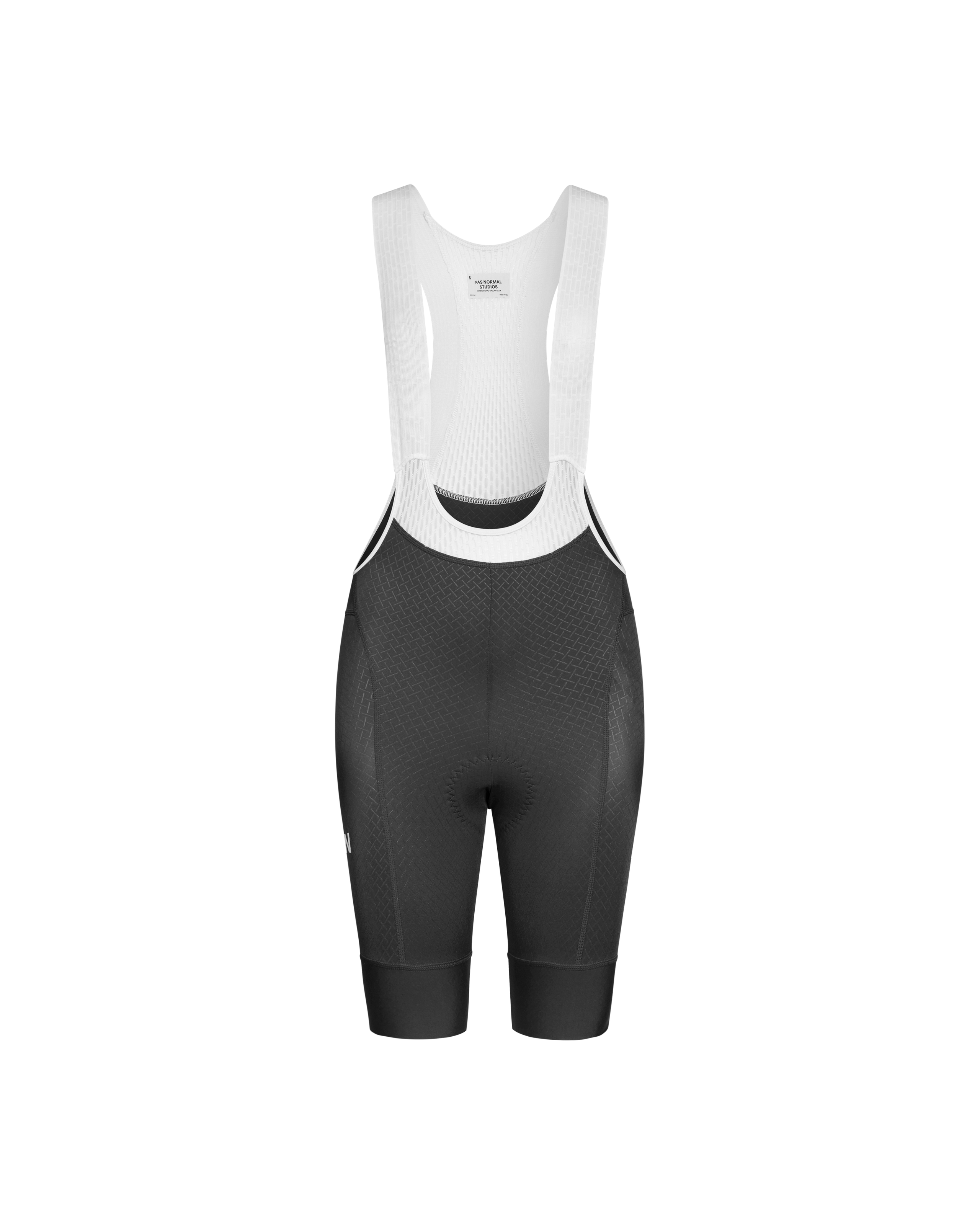 Black Mechanism cycling bibs, front flat lay with white shoulder straps and textured leg panels