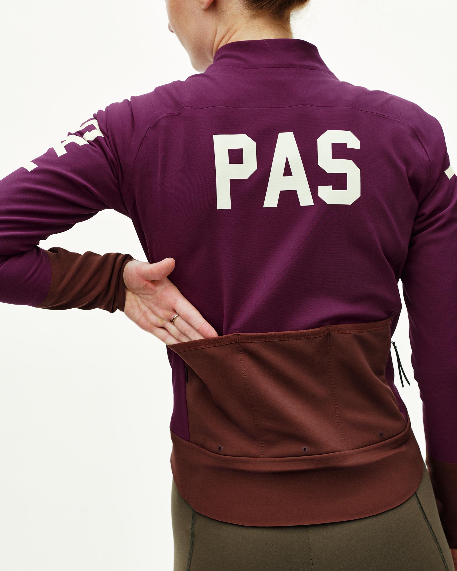 Dark Purple PAS Mechanism thermal cycling jacket on model, rear view with cream PAS back print and brown contrast lower panel