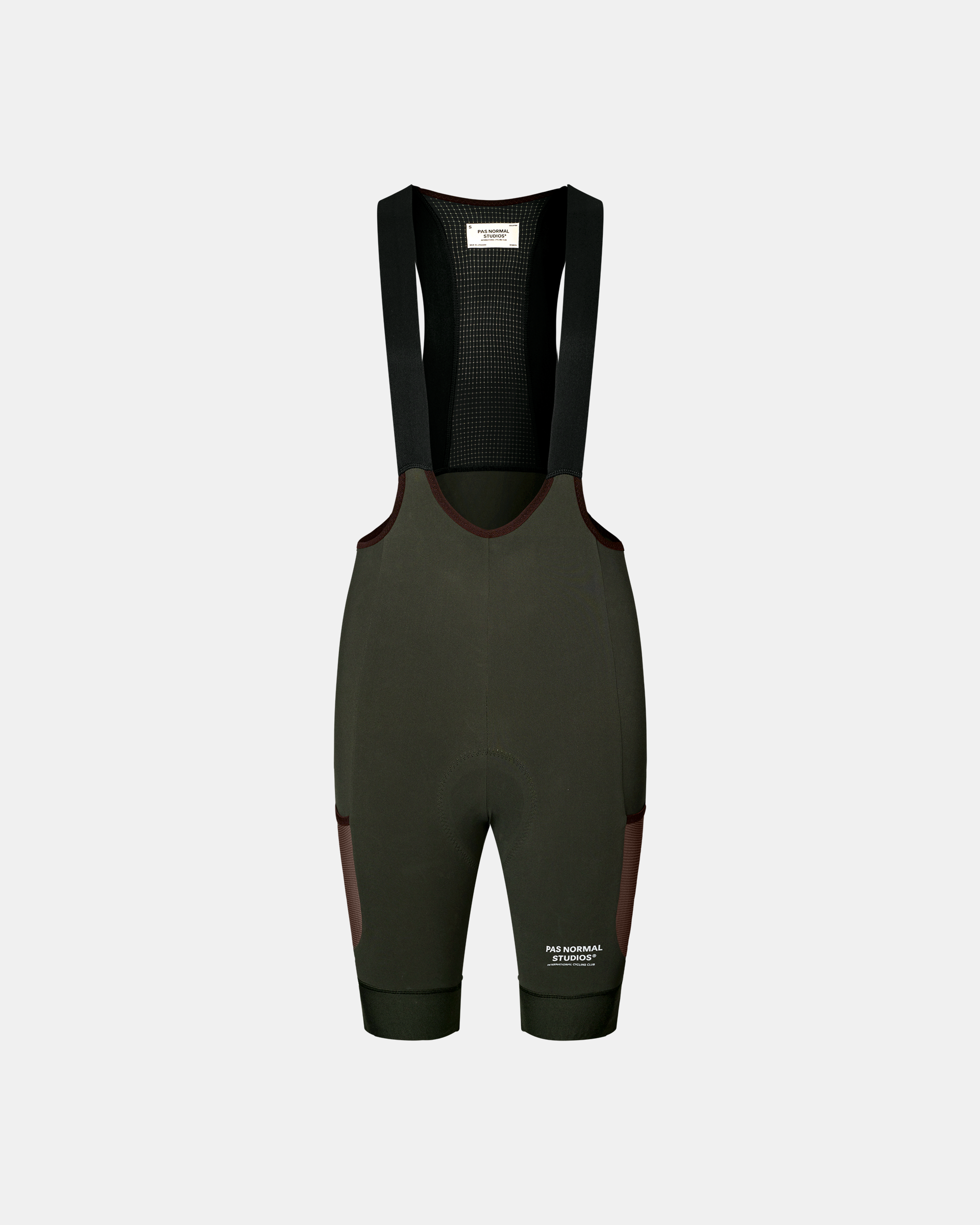 Dark Olive Escapism Cargo cycling bibs, front flat lay with contrast dark red side panels and mesh bib panel