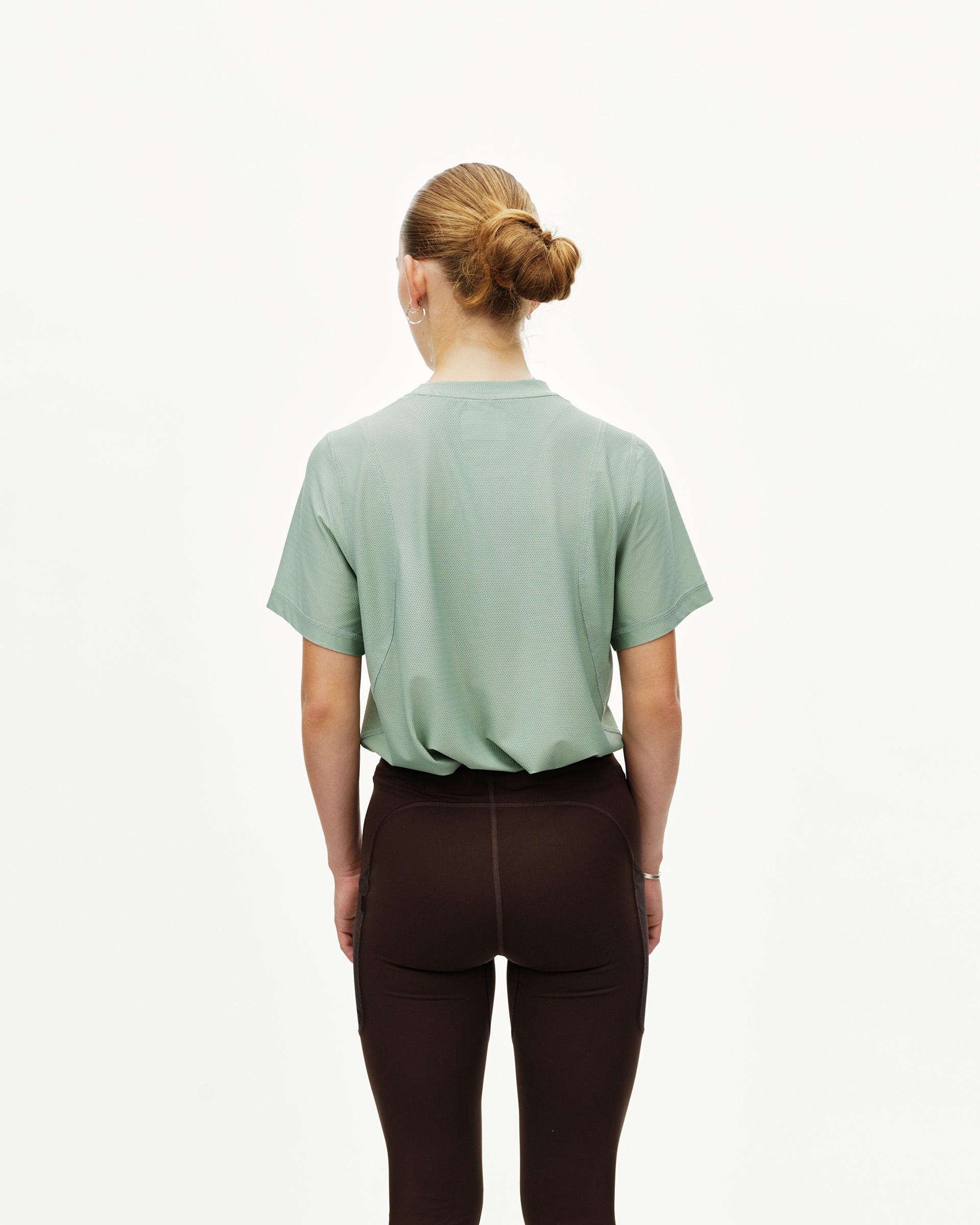 Dark Coffee brown Balance long tights on model, rear view with contrast seam paneling