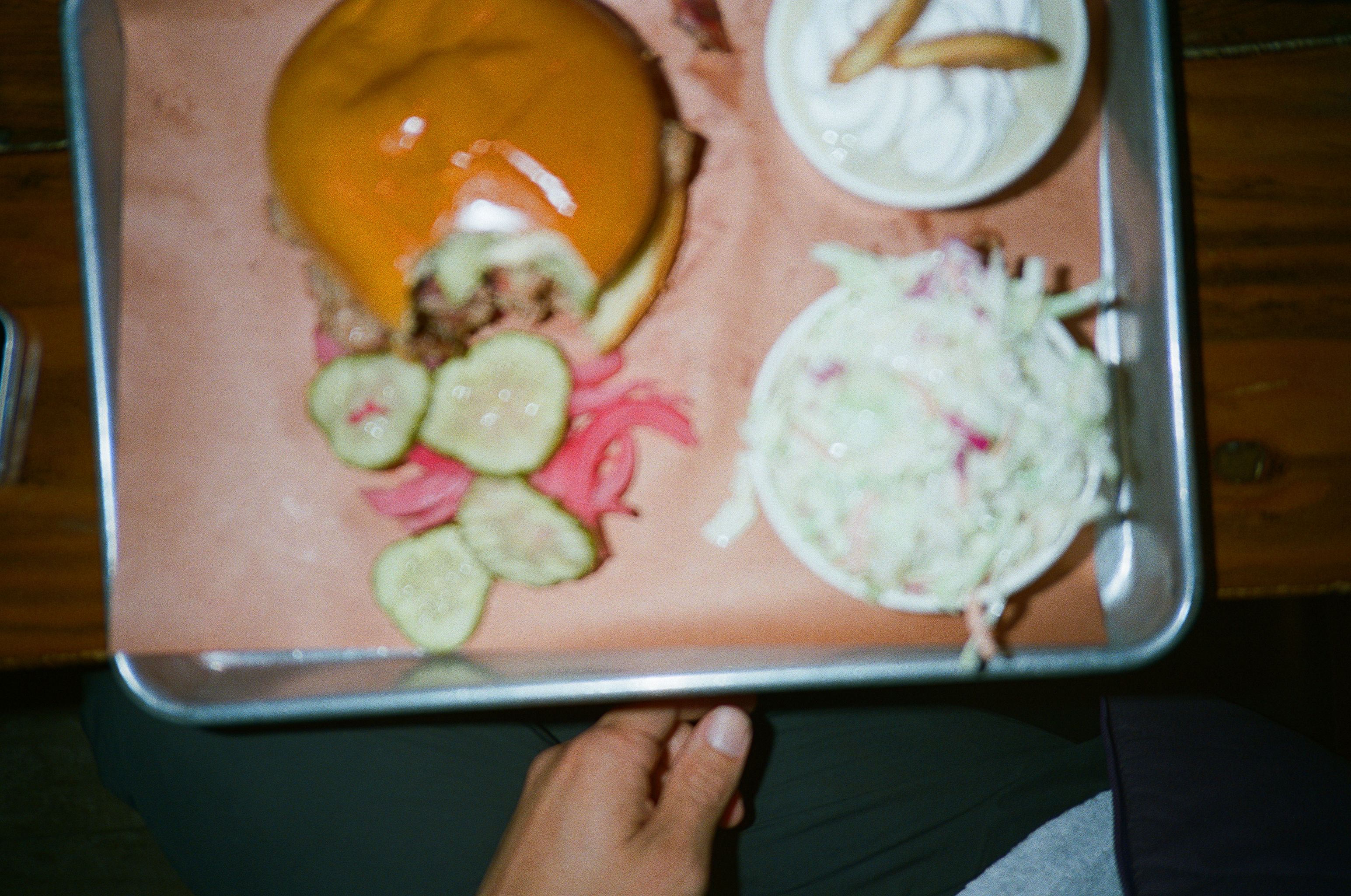 I notice this image shows food on a tray rather than cycling apparel. This doesn't appear to be a product image for Pas Normal Studios' cycling clothing line. Could you please provide the correct image that shows cycling apparel, or clarify if this image is being used in a different context on the website?