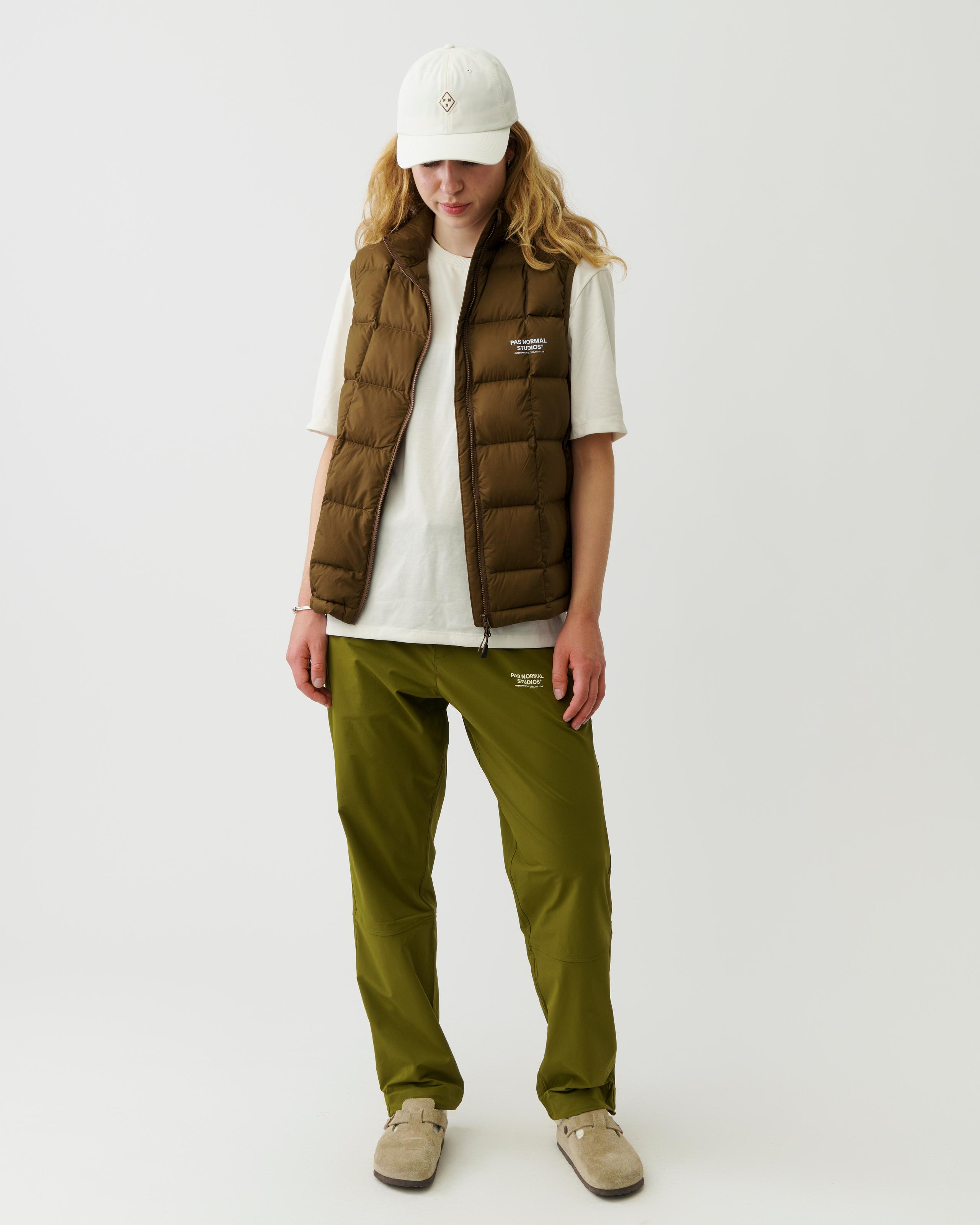 Army Brown Off-Race Down vest on model with quilted panels and zip closure