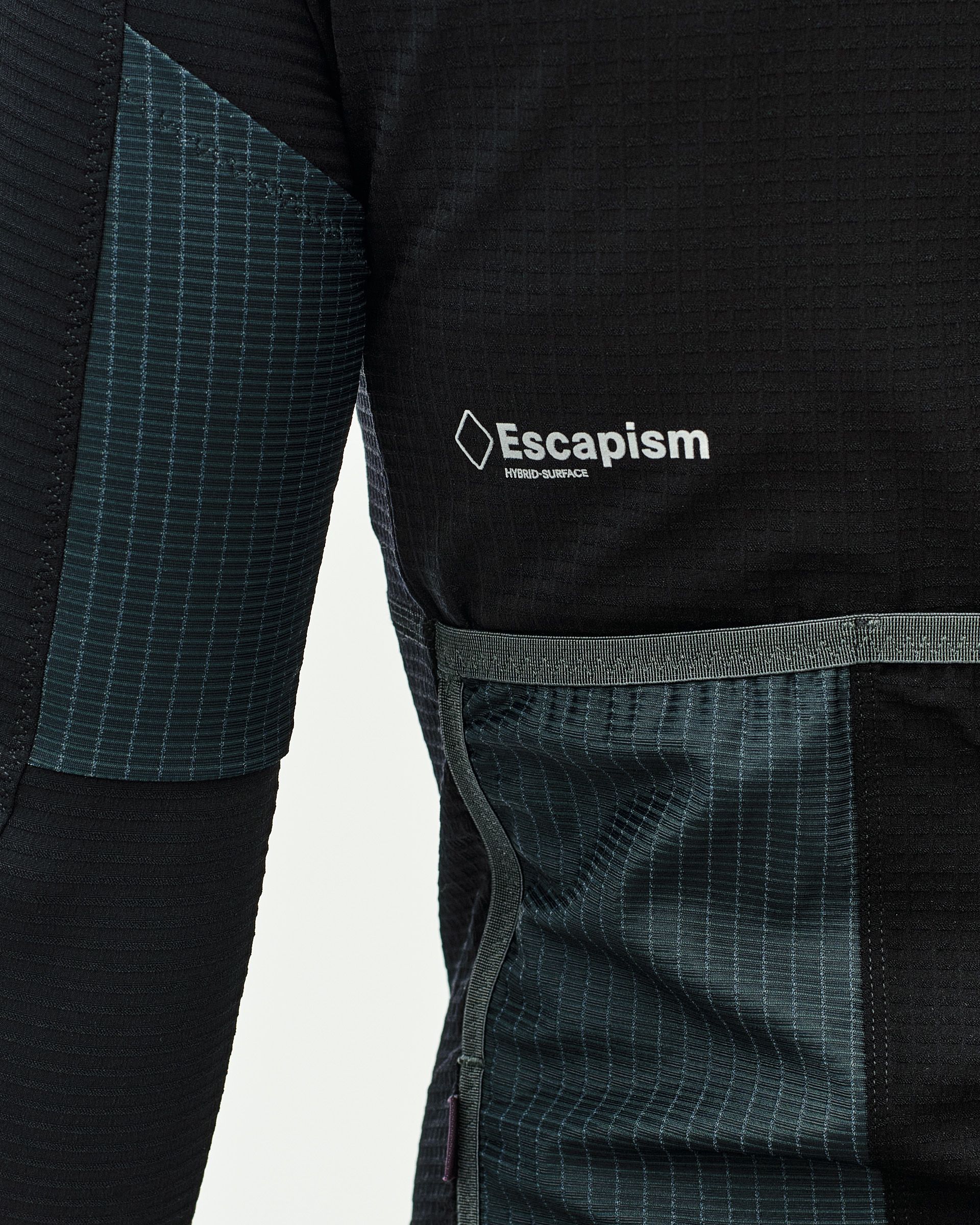 Stone Brown Escapism long sleeve cycling jersey, side detail with chest logo and gridded fabric panels
