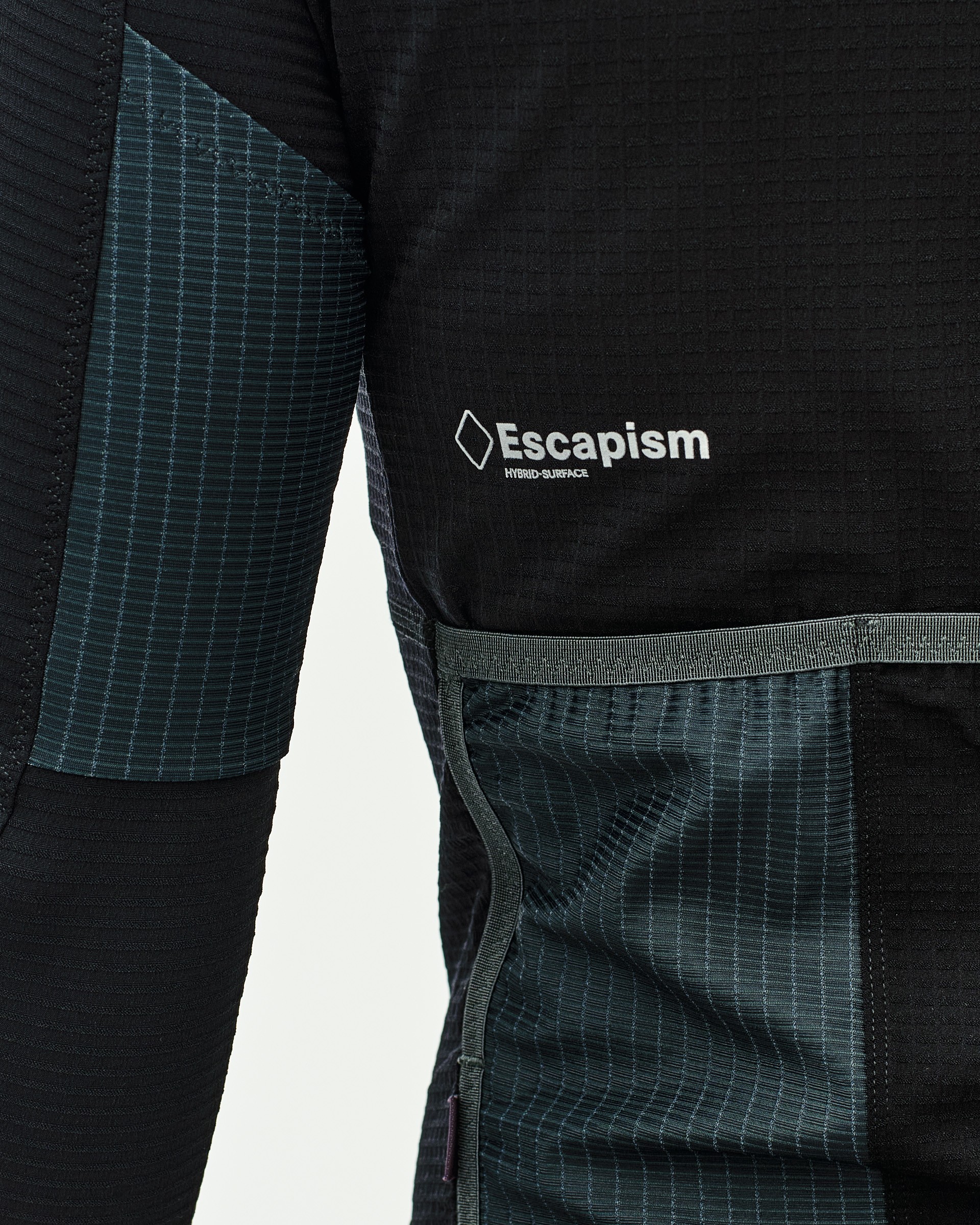 Stone Brown Escapism long sleeve cycling jersey, side detail with chest logo and gridded fabric panels