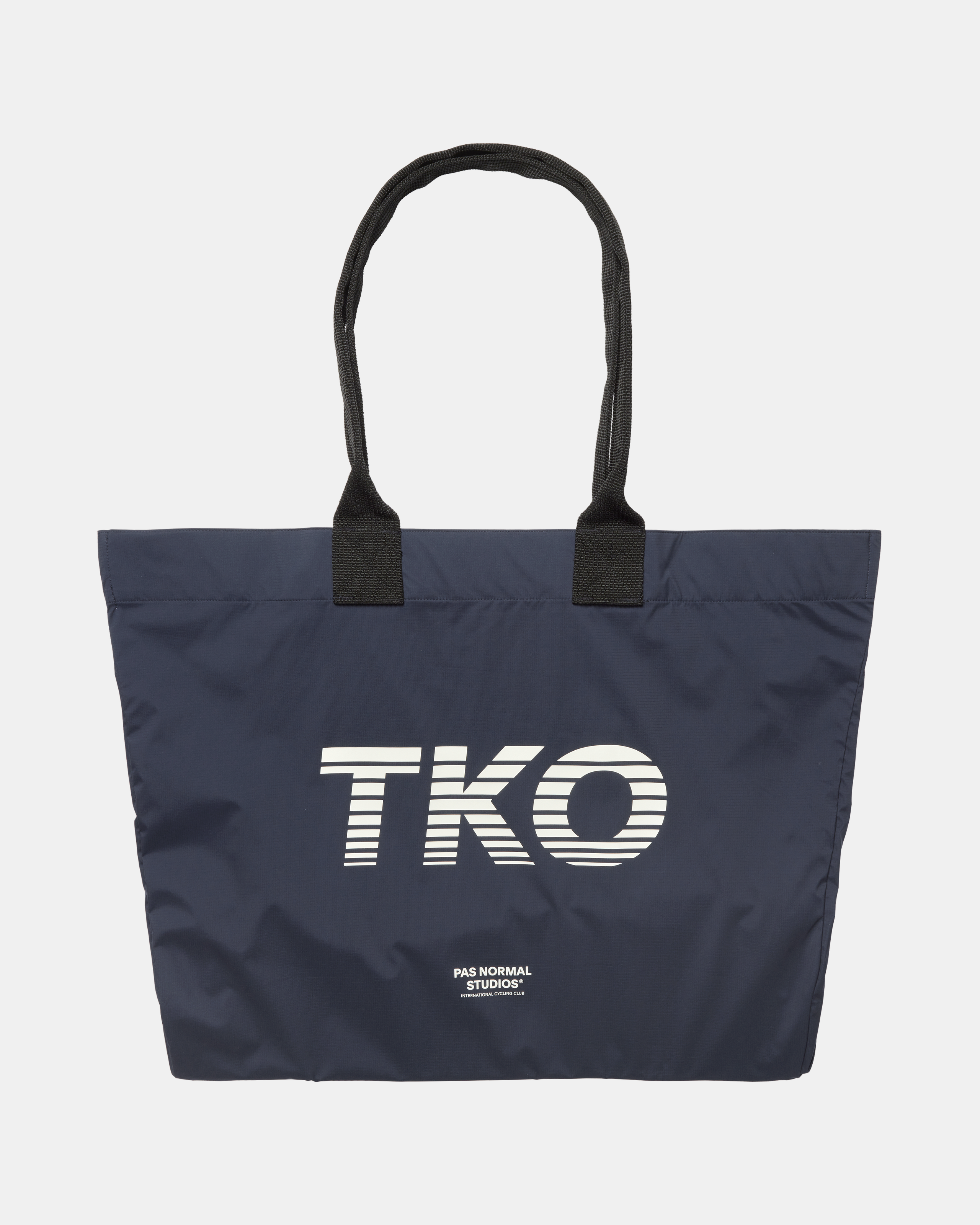 Navy T.K.O. Shield tote bag, front flat lay with large striped TKO chest print and black handles