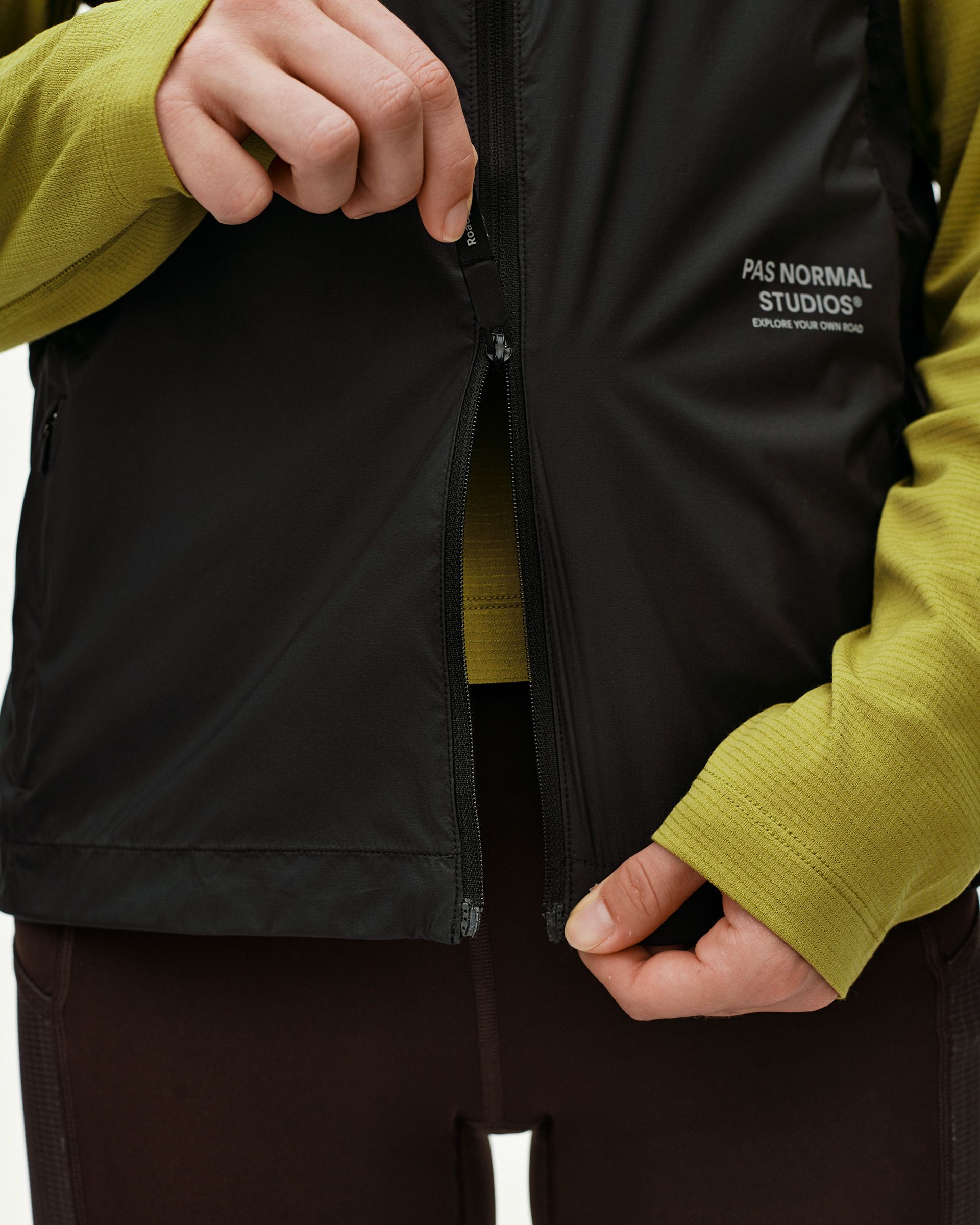 Black Balance Windproof Vest, front detail on model with open centre zip