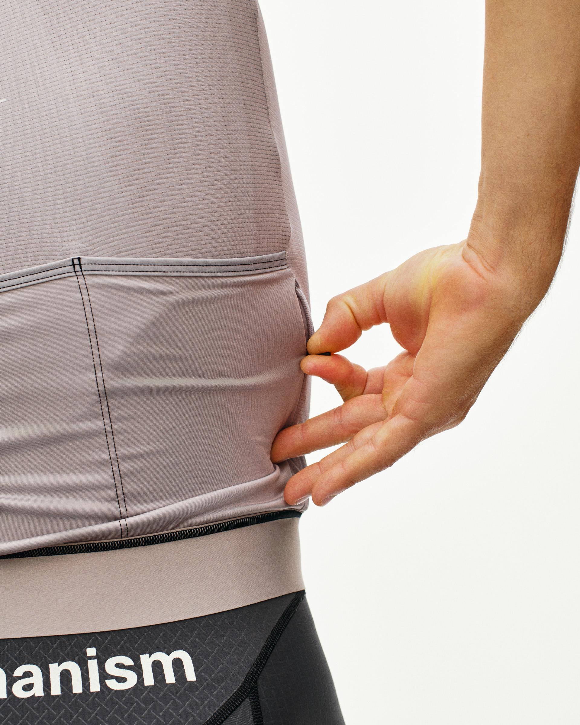 Haze Mechanism cycling jersey on model showing rear zip pocket detail