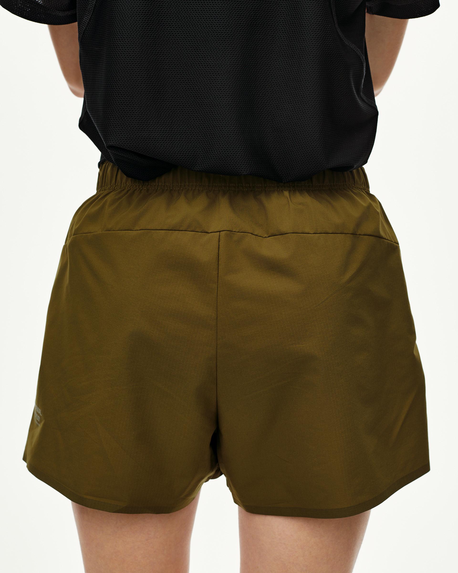 Moss Brown Balance women's shorts, rear view on model with elastic waistband
