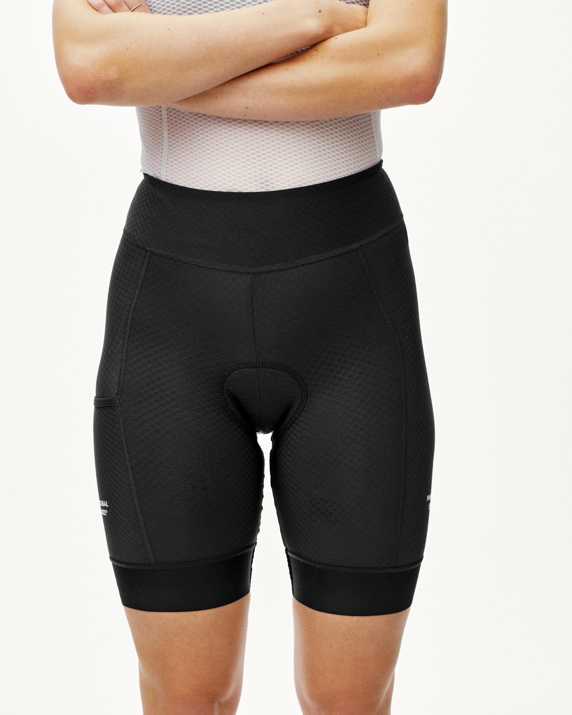 Black Essential short tights on model, front view with high waistband and chamois pad