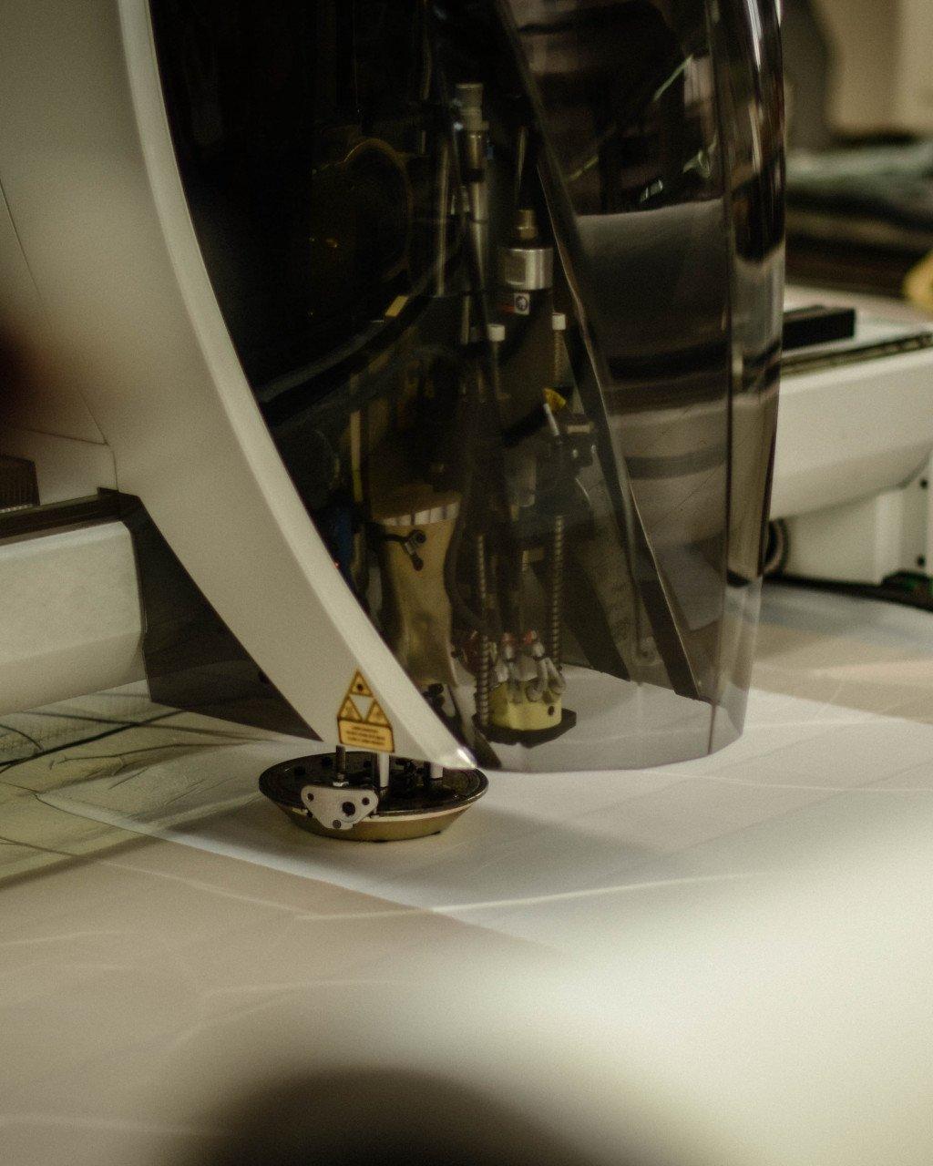 Close-up of cycling shoe cleat mechanism and pedal system in white laboratory setting