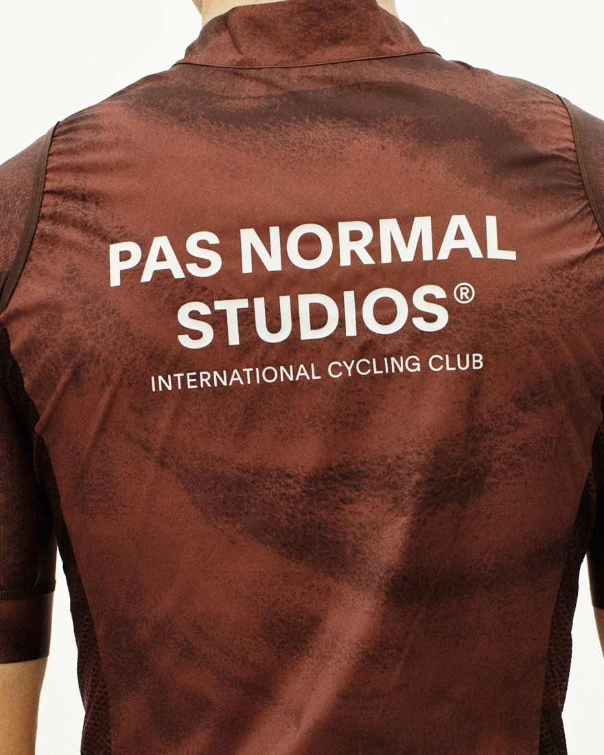 Light Brown Mechanism Stow Away gilet, rear view on model with white brand text