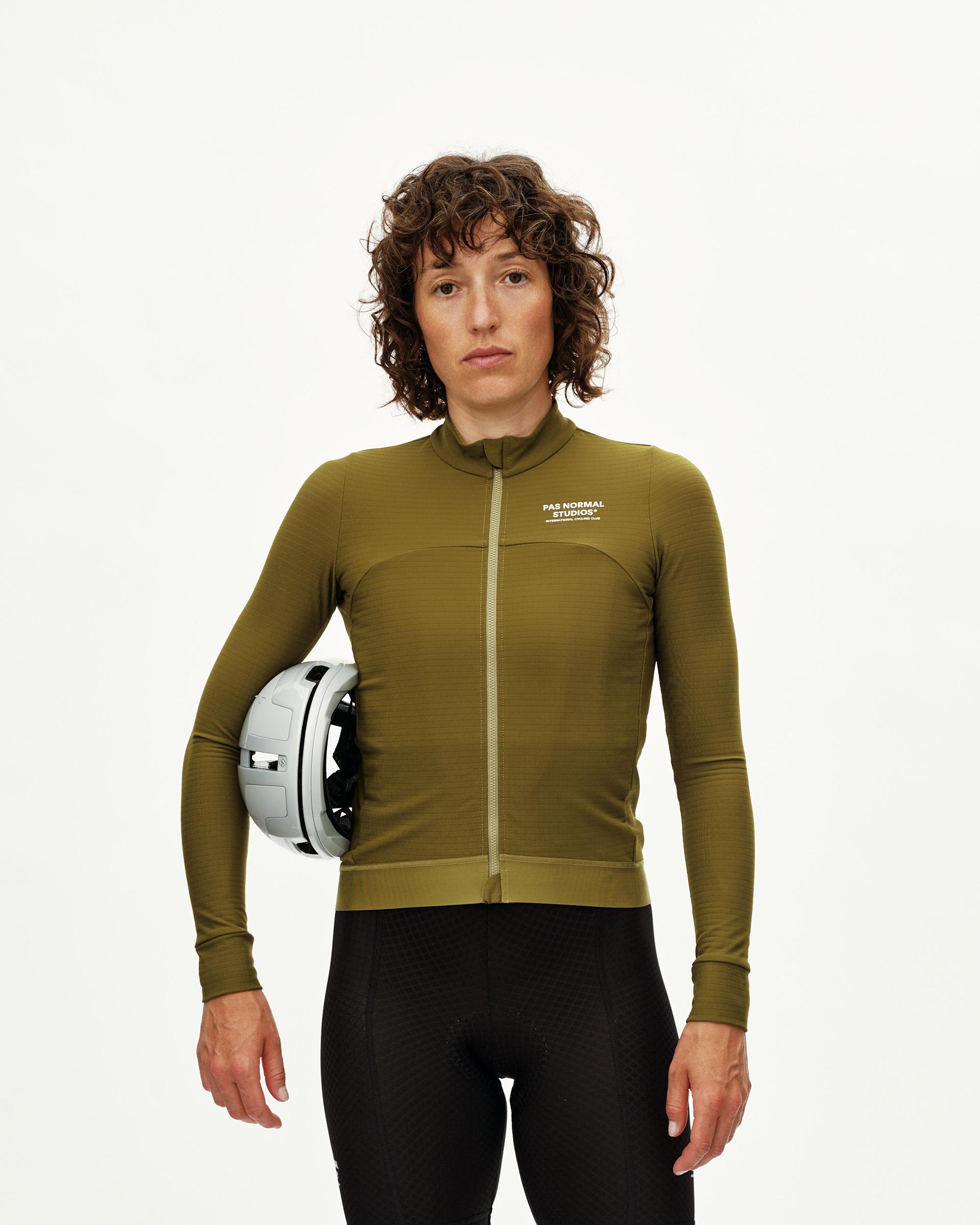 Khaki Green Essential long sleeve cycling jersey, front view on model with white chest print