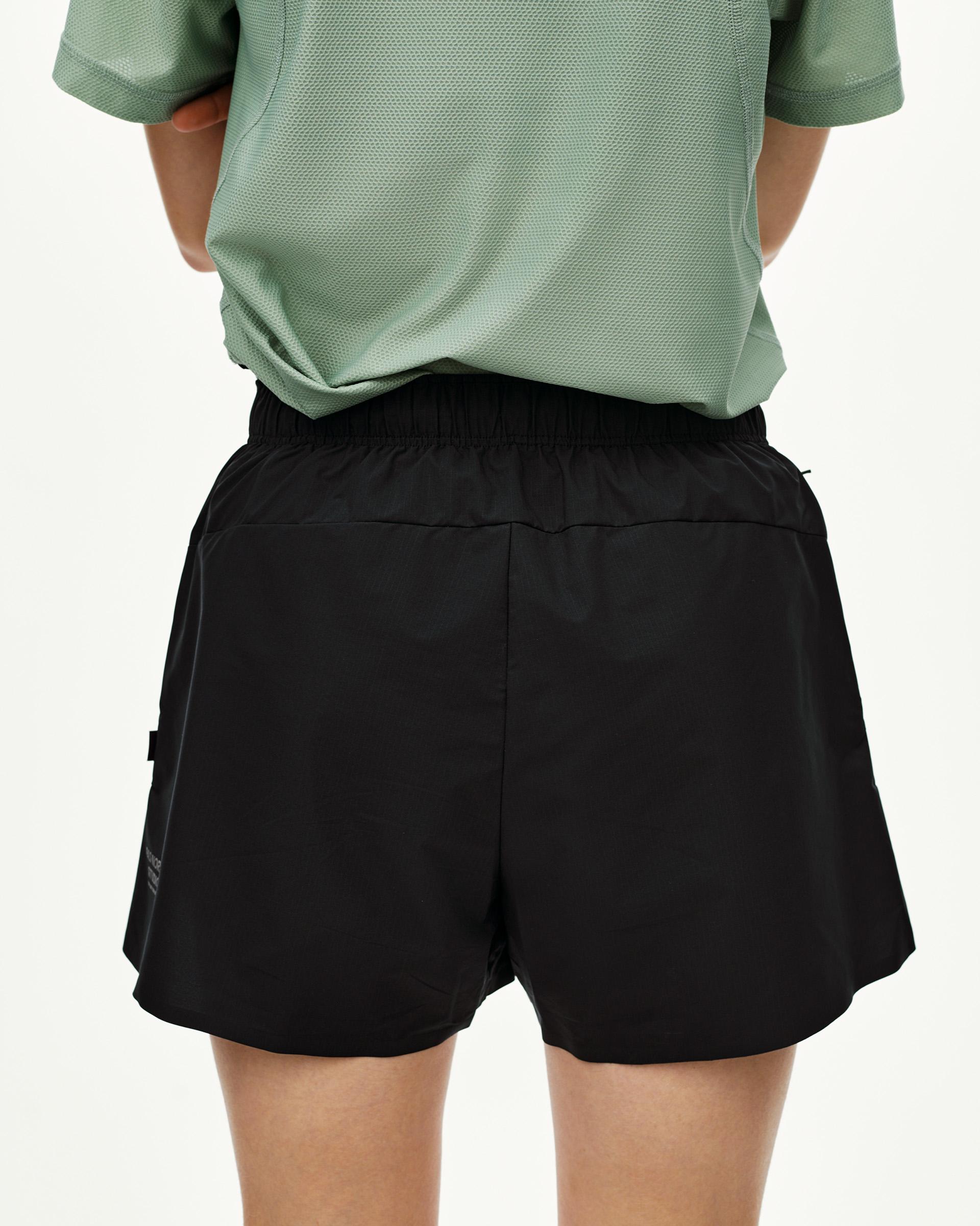 Black Balance women's shorts, rear view on model with elastic waistband and side pocket