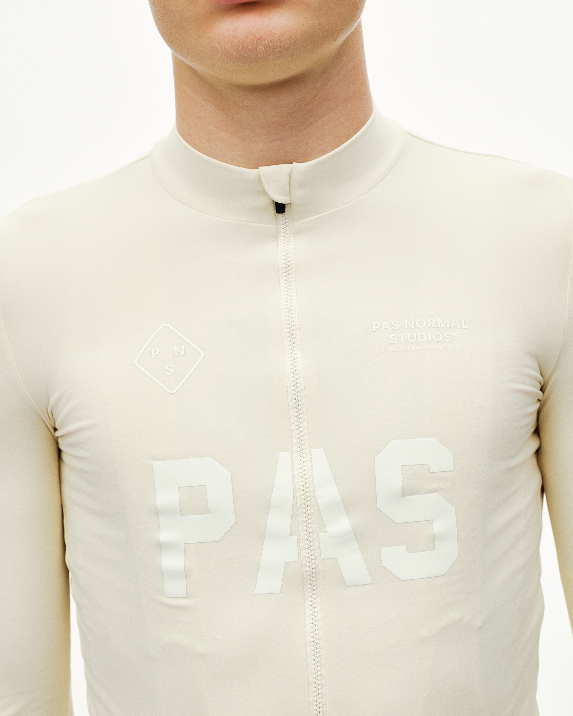 Sand PAS Mechanism long sleeve cycling jersey, front detail on model with tonal chest logo print