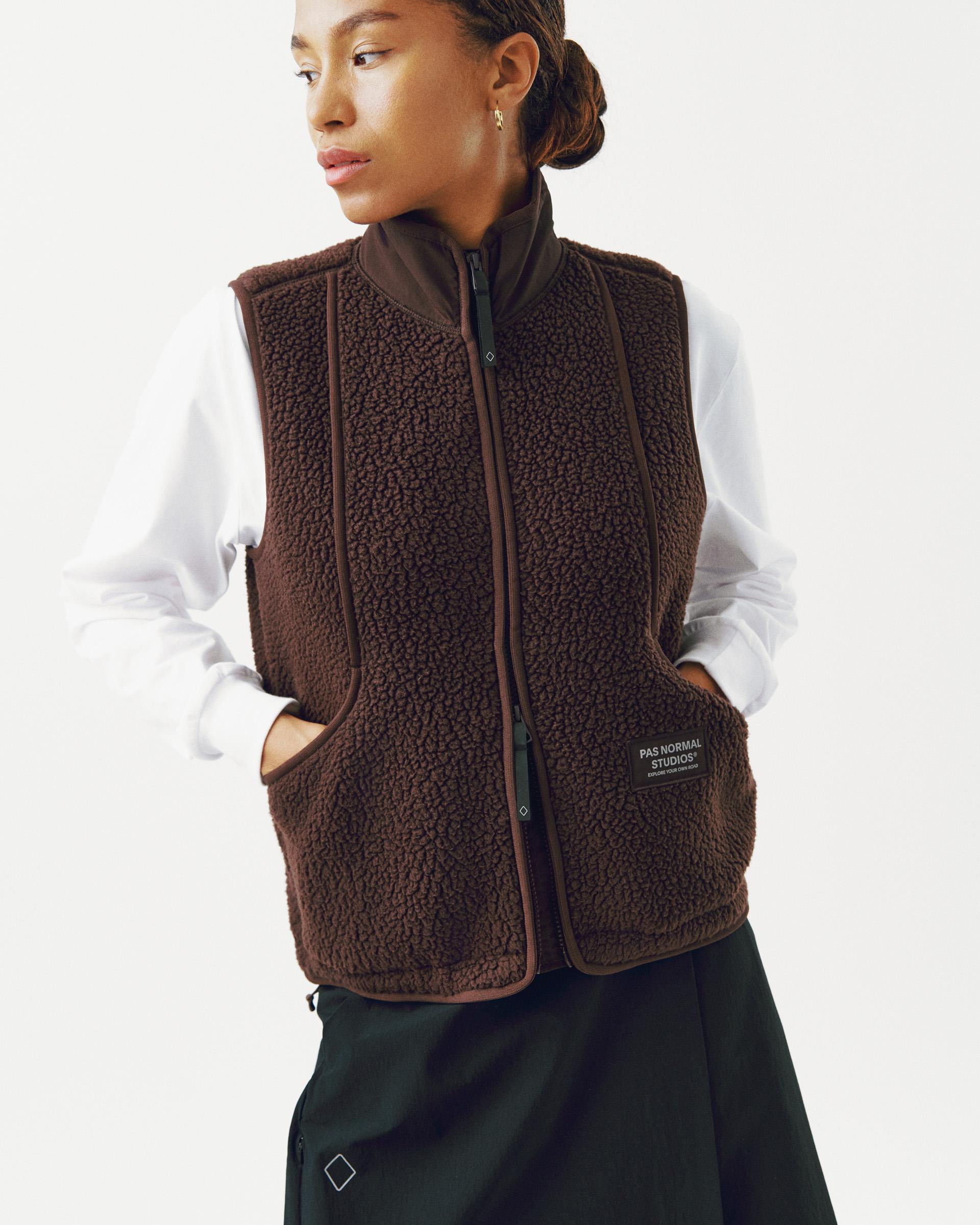 Light Brown Off-Race Pile Fleece vest on model, front three-quarter view with sherpa fleece texture
