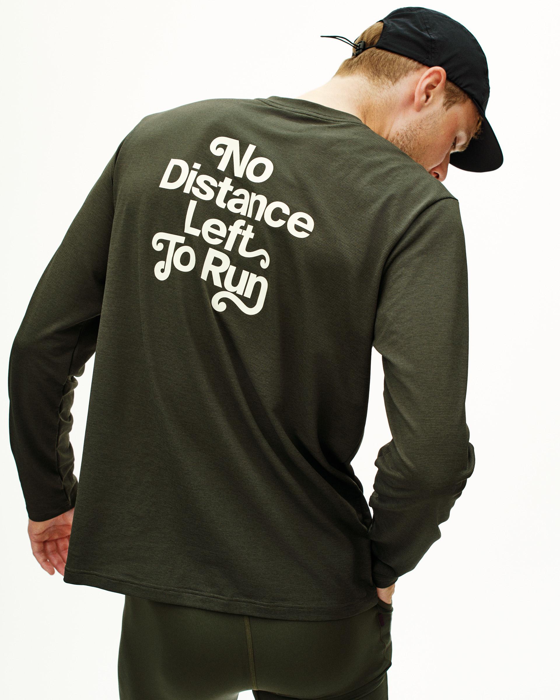 Dark Olive Balance long sleeve t-shirt on model, rear view with white No Distance Left To Run print
